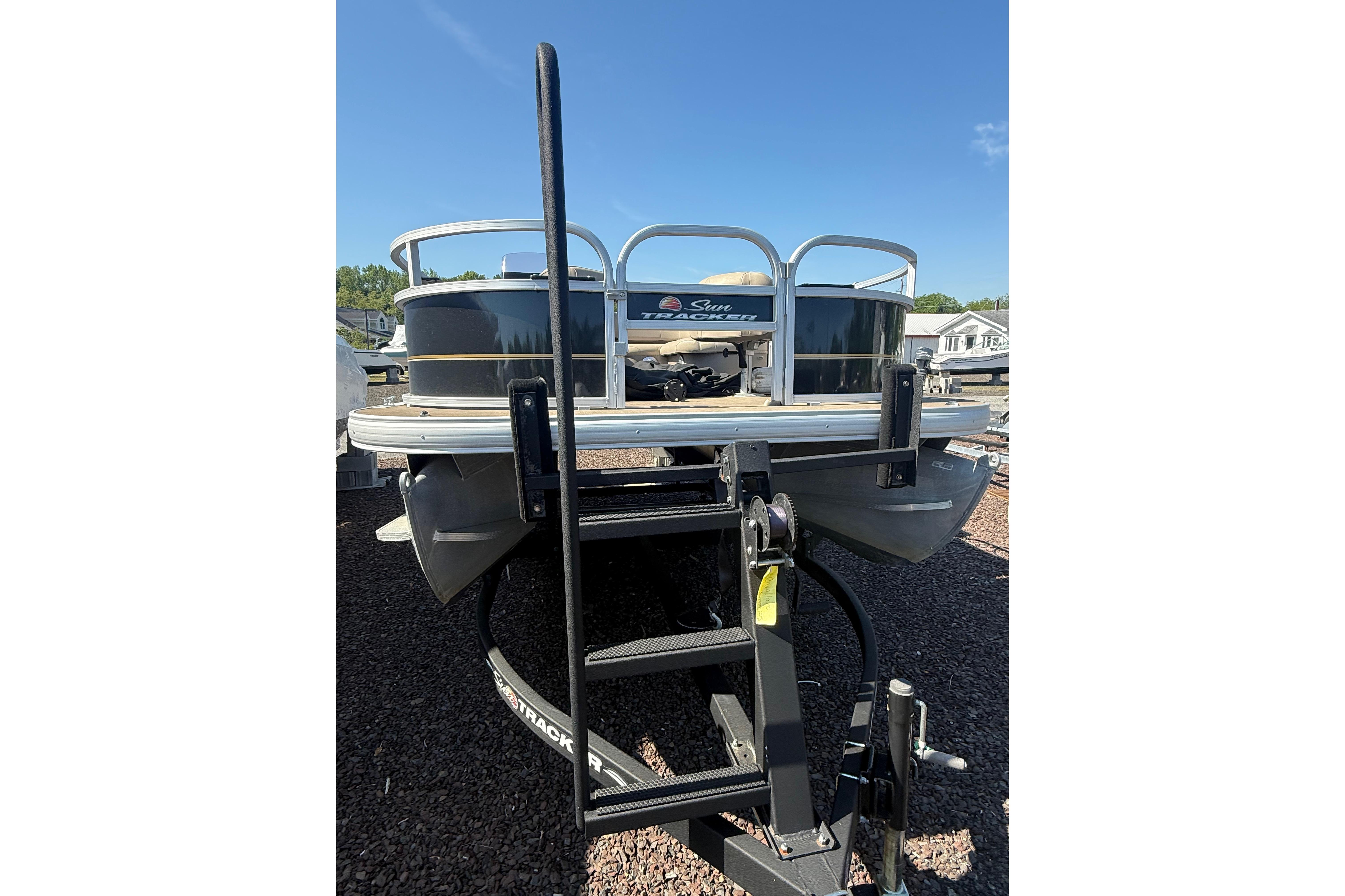 2021 Sun Tracker Bass Buggy 16 XL Select pontoon boat on trailer.