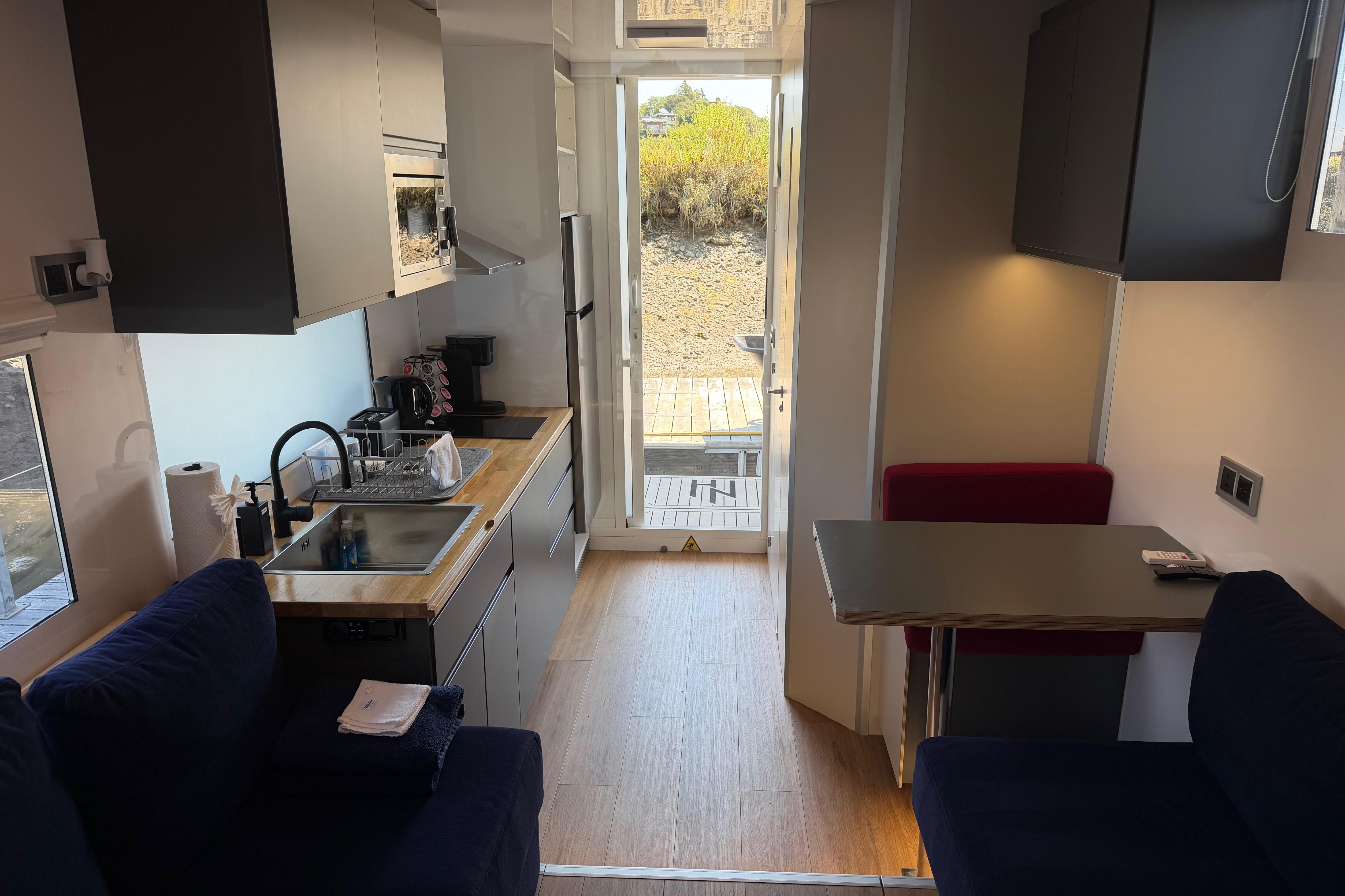 Modern interior of 2022 Navisyo NV.08 with kitchen and seating area.