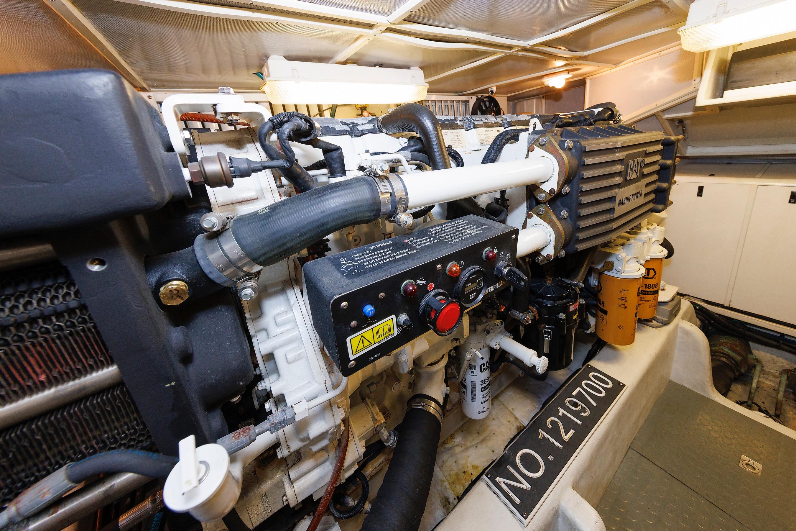 Engine room of 2009 Hunt Yachts 52 Express, featuring CAT marine power system.