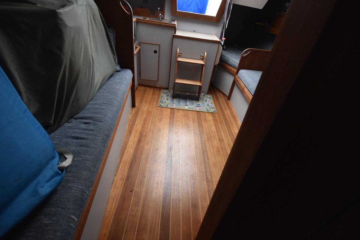 Interior of a 1987 S2 9.2A with wooden floor and seating area.