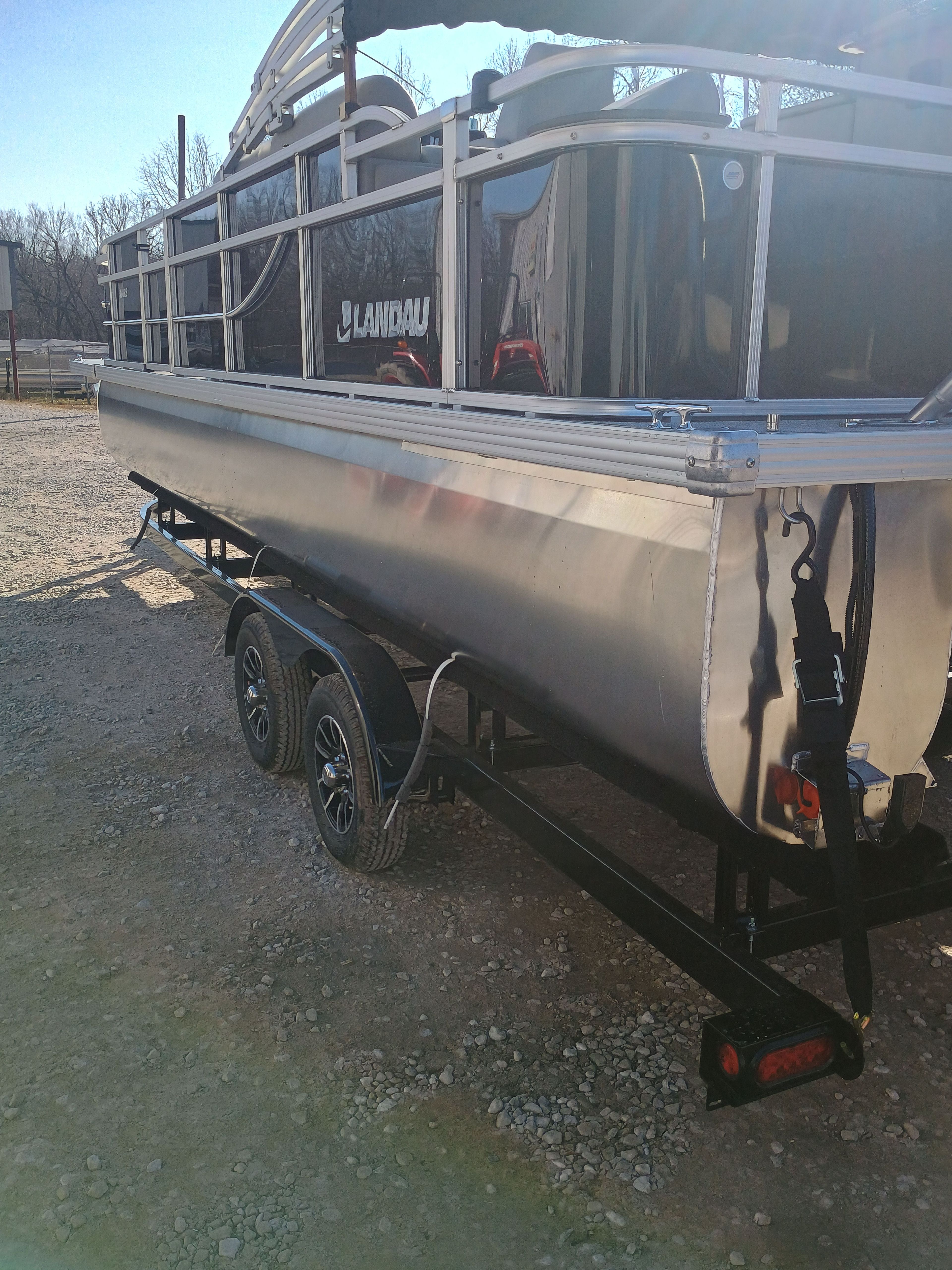 Landau Alure 25CC Fish-Black 2026 on trailer, side view.