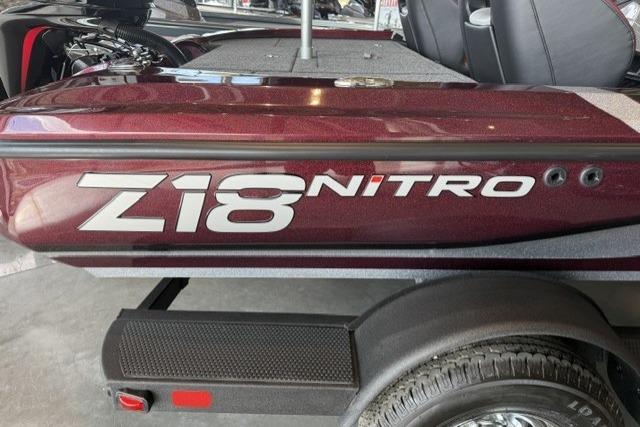 2026 Nitro Z18 boat, maroon color, close-up view of side branding.