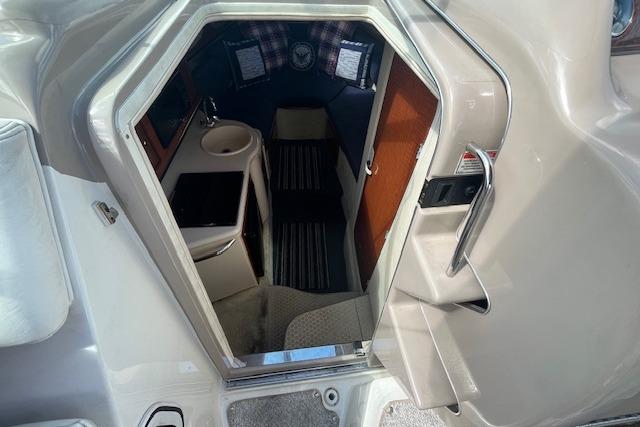 Interior cabin view of 2003 Sea Ray 260 Sundancer boat, featuring compact amenities.