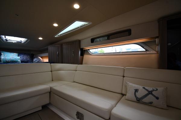 Luxurious interior of 2021 Regal 35 Sport Coupe with plush seating and nautical decor.