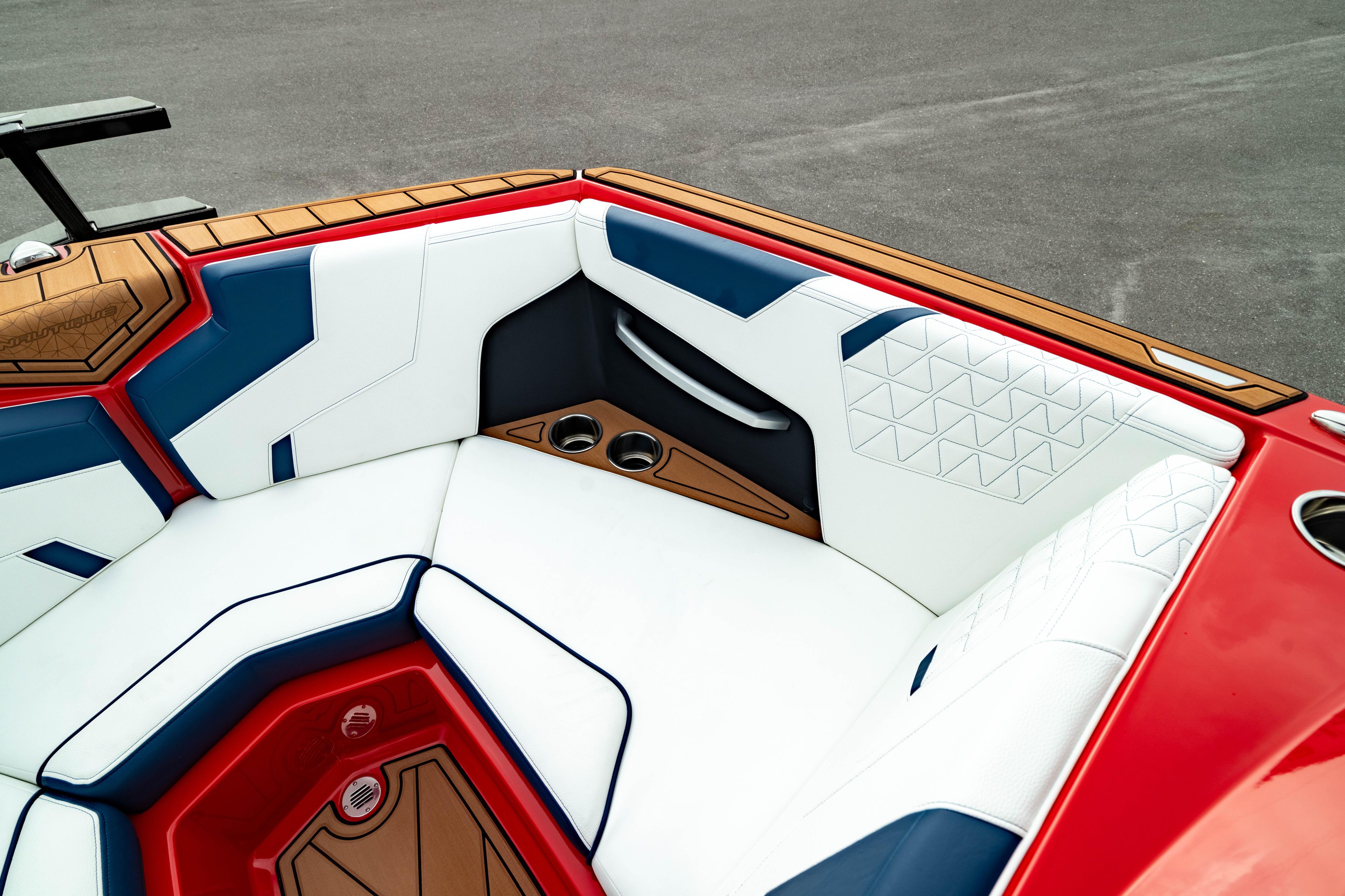 2025 Nautique Super Air Nautique GS20 interior with red, white, and blue seating.