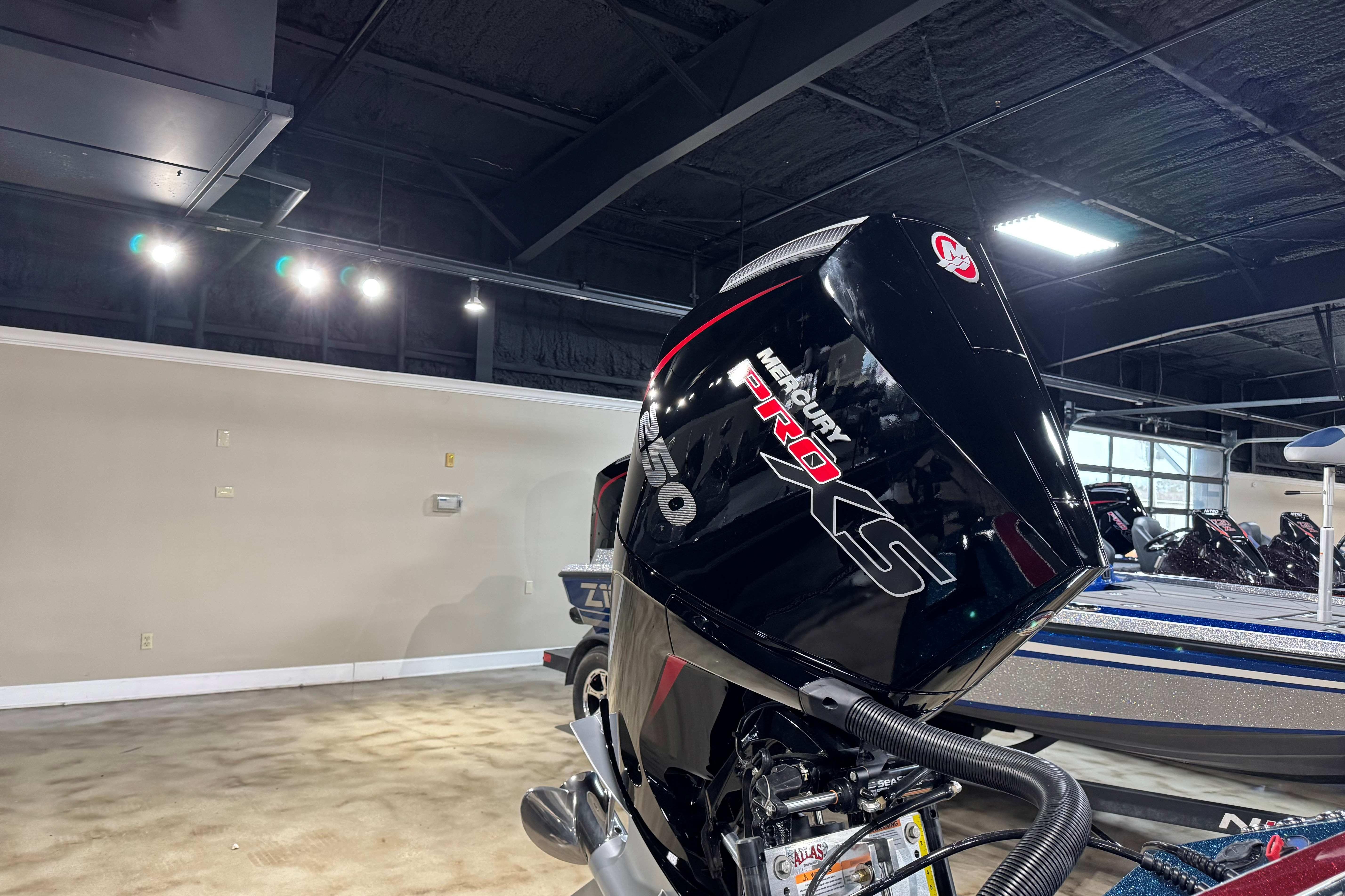 2025 Ranger Z520R Cup-Equipped boat with Mercury Pro XS engine in showroom.