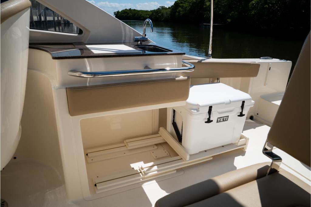 2023 Scout 240 Dorado boat interior with Yeti cooler and sink.