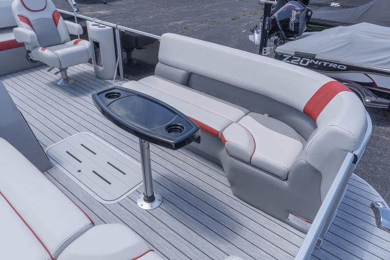 2026 SunCatcher Select 322SL pontoon boat interior with seating and table.