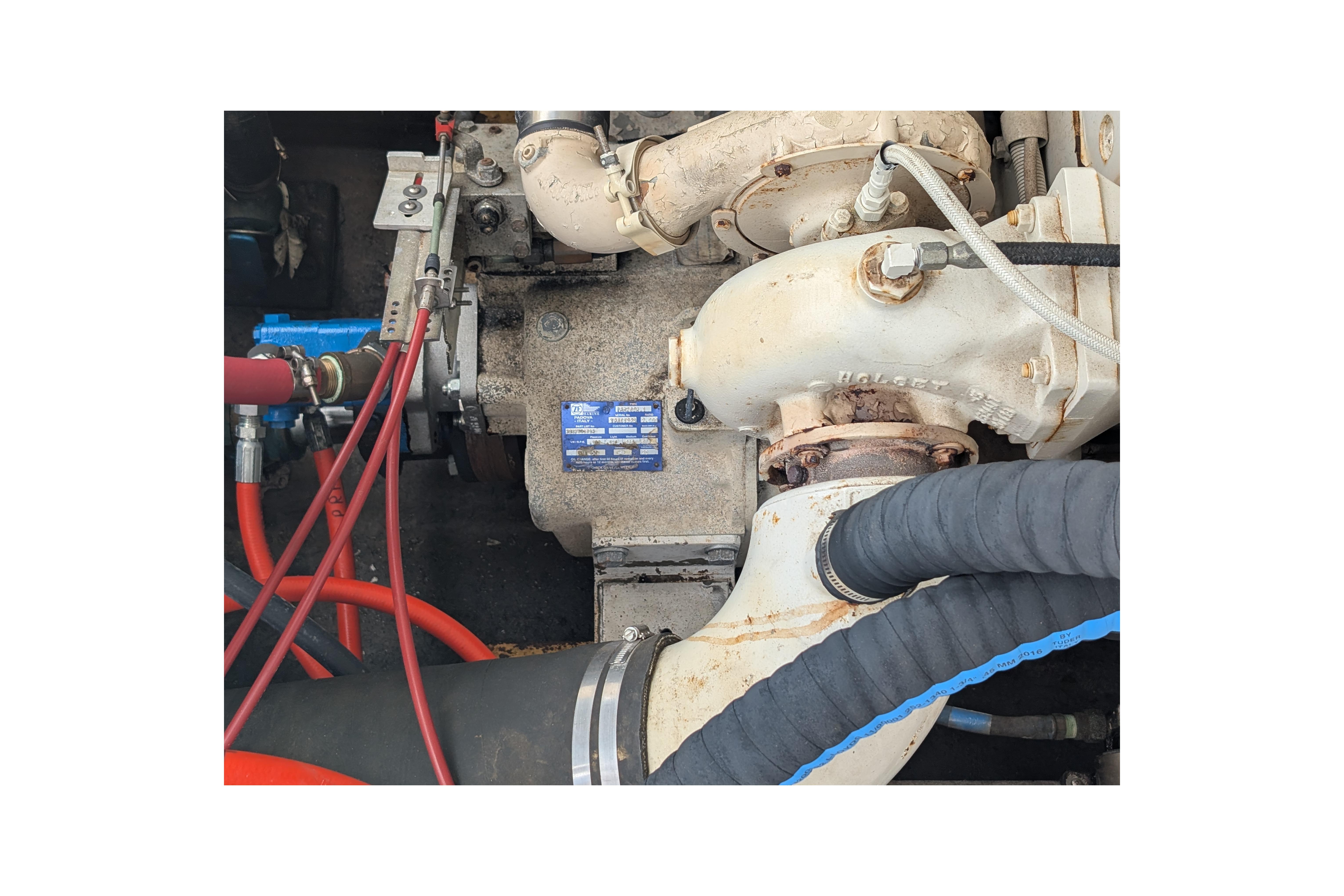 Engine compartment of a 1998 Markley 46 boat, featuring hoses and mechanical components.