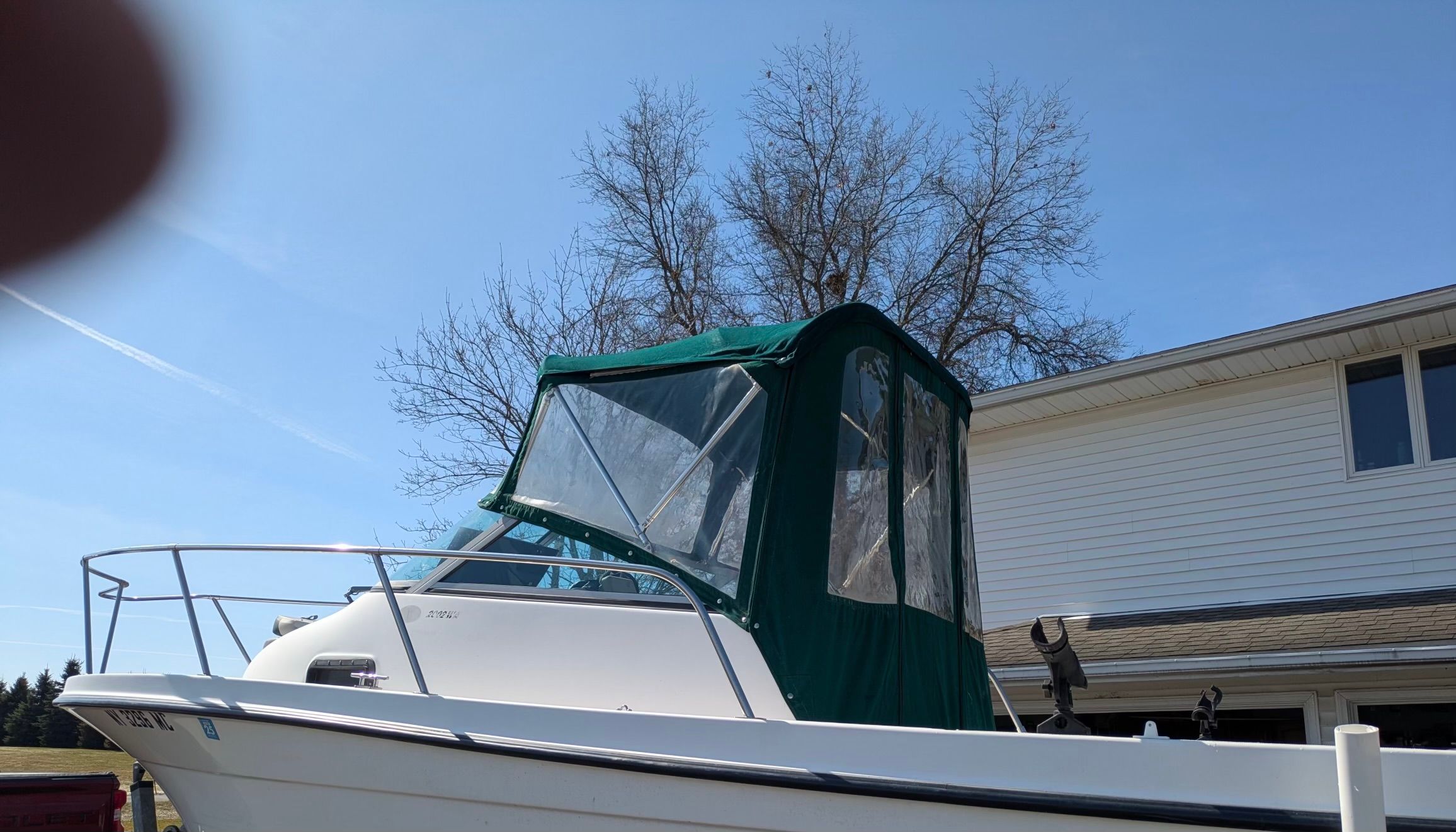 2005 Bayliner Trophy boat parked in front of a house.