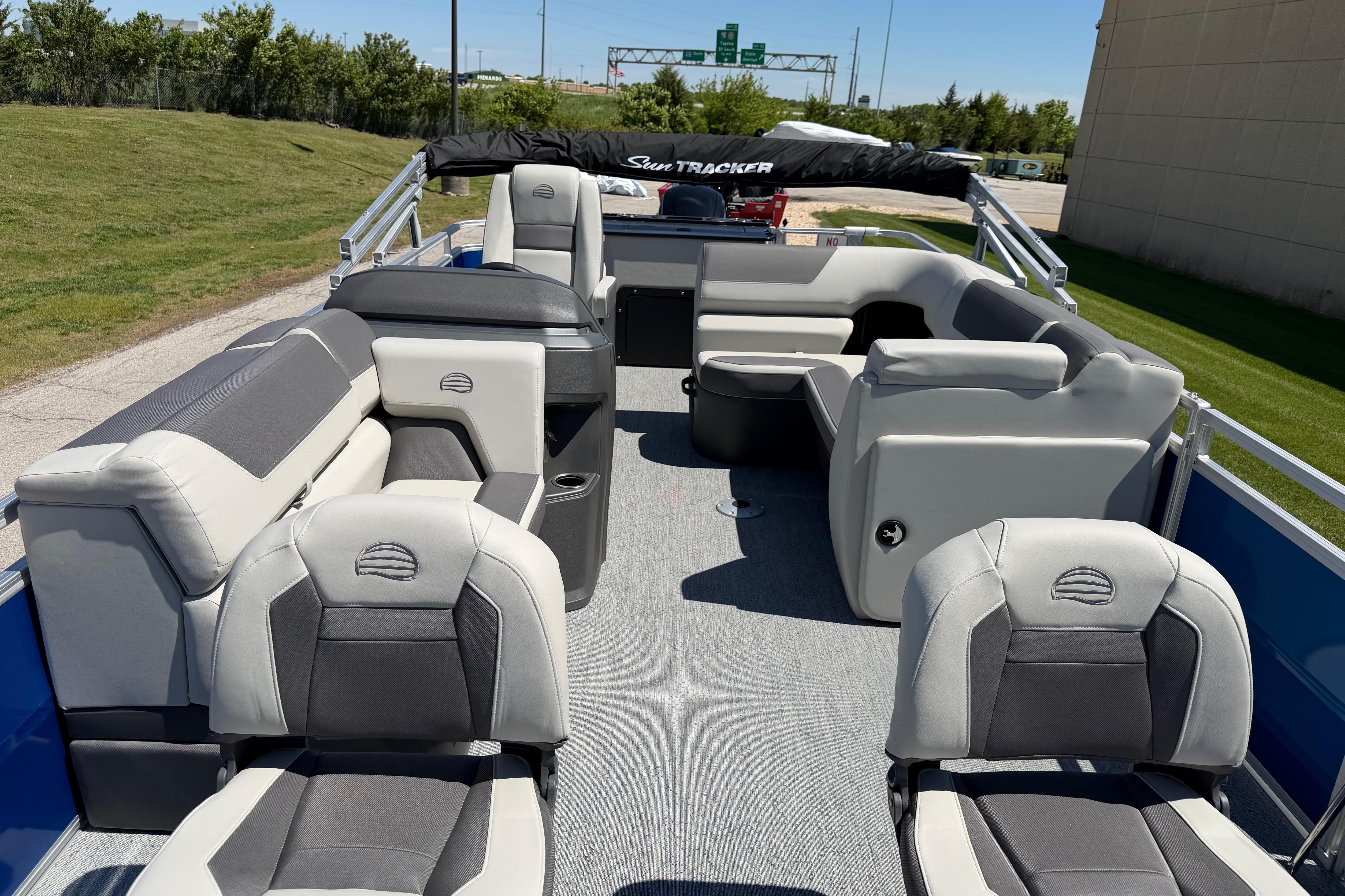 2026 Sun Tracker Fishin' Barge 20 DLX interior with plush seating and modern design.