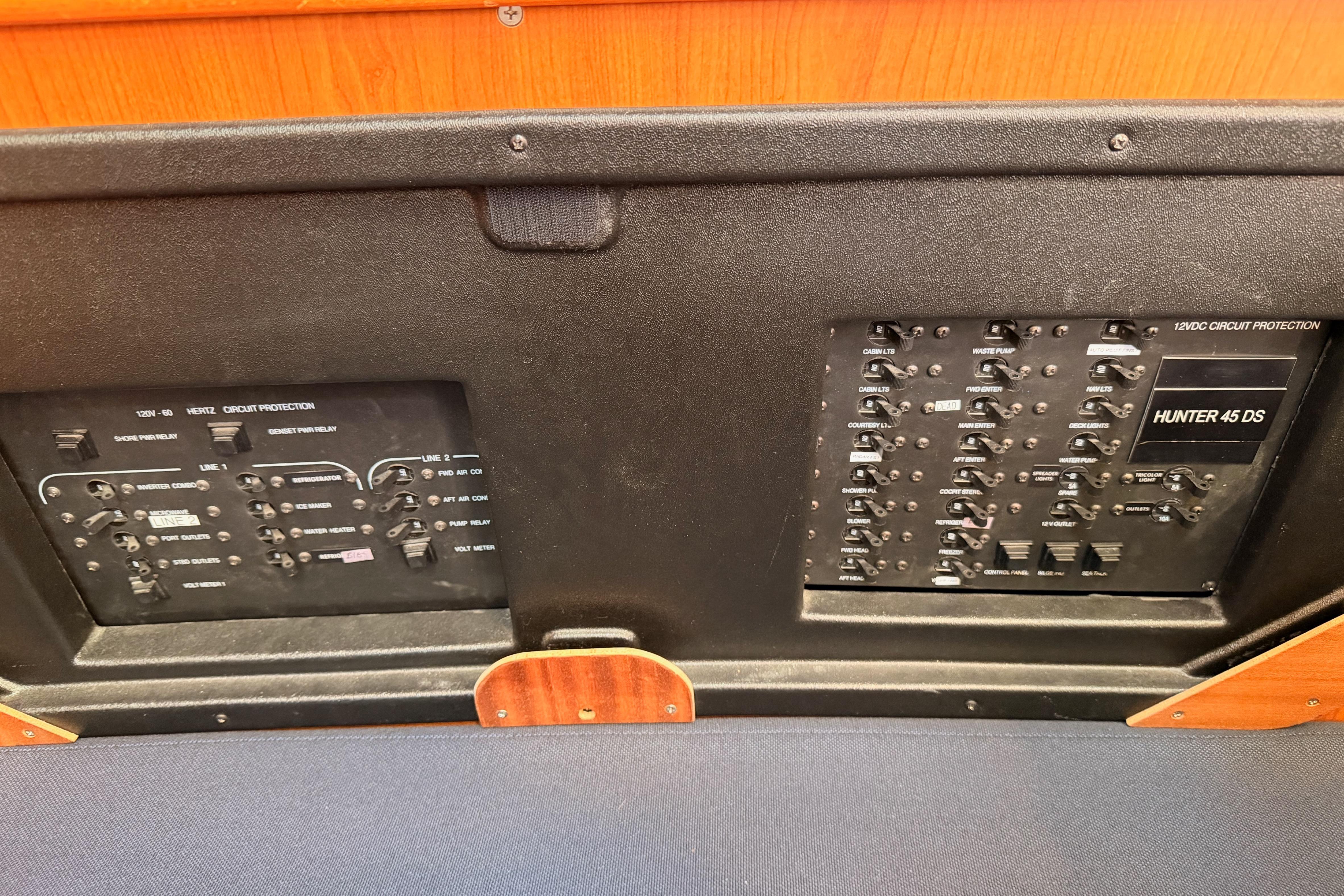 Electrical panel of a 2008 Hunter 45 Deck Salon yacht, featuring circuit protection switches.