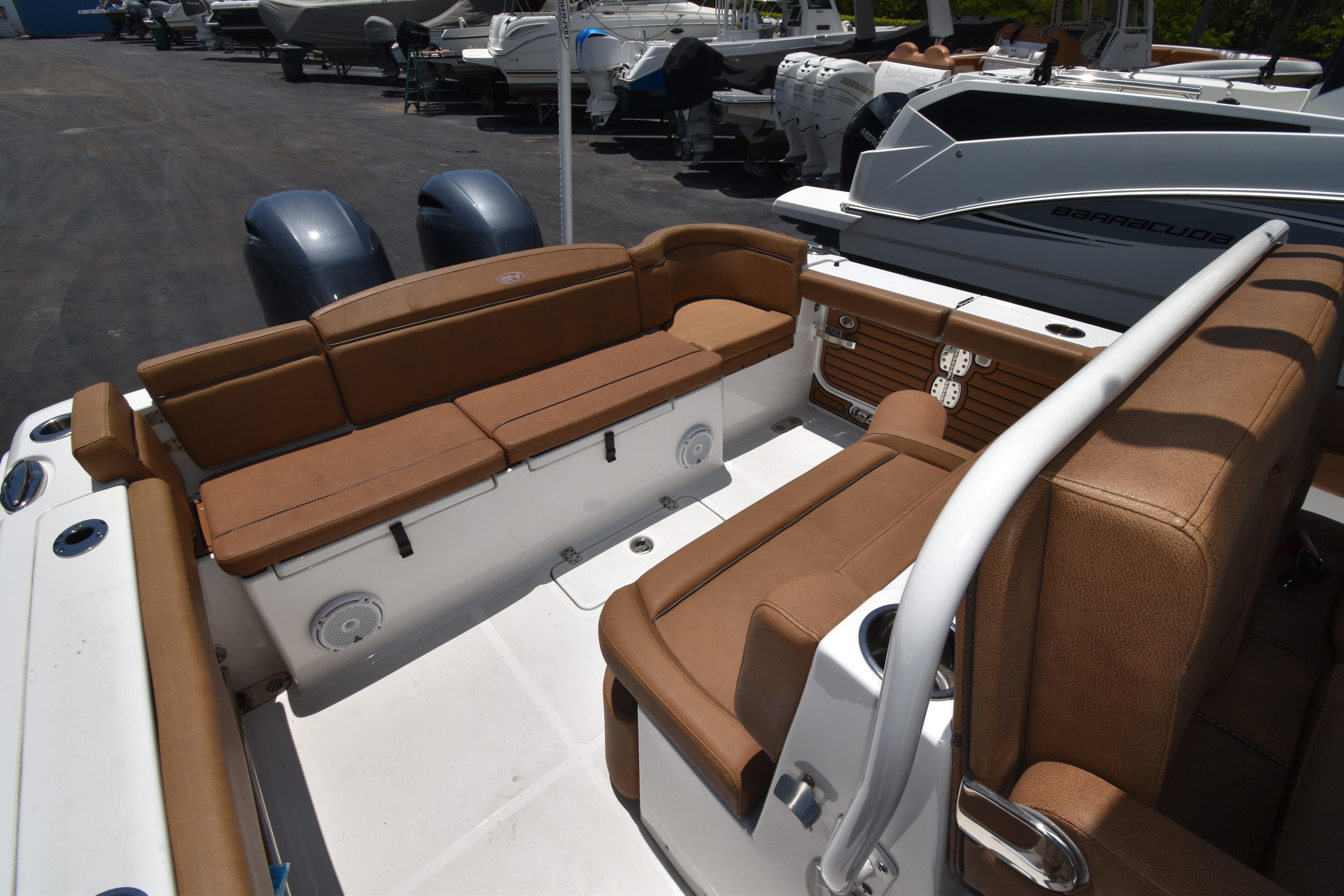 2020 Sea Hunt Ultra 275 SE boat interior with tan seating and dual engines.