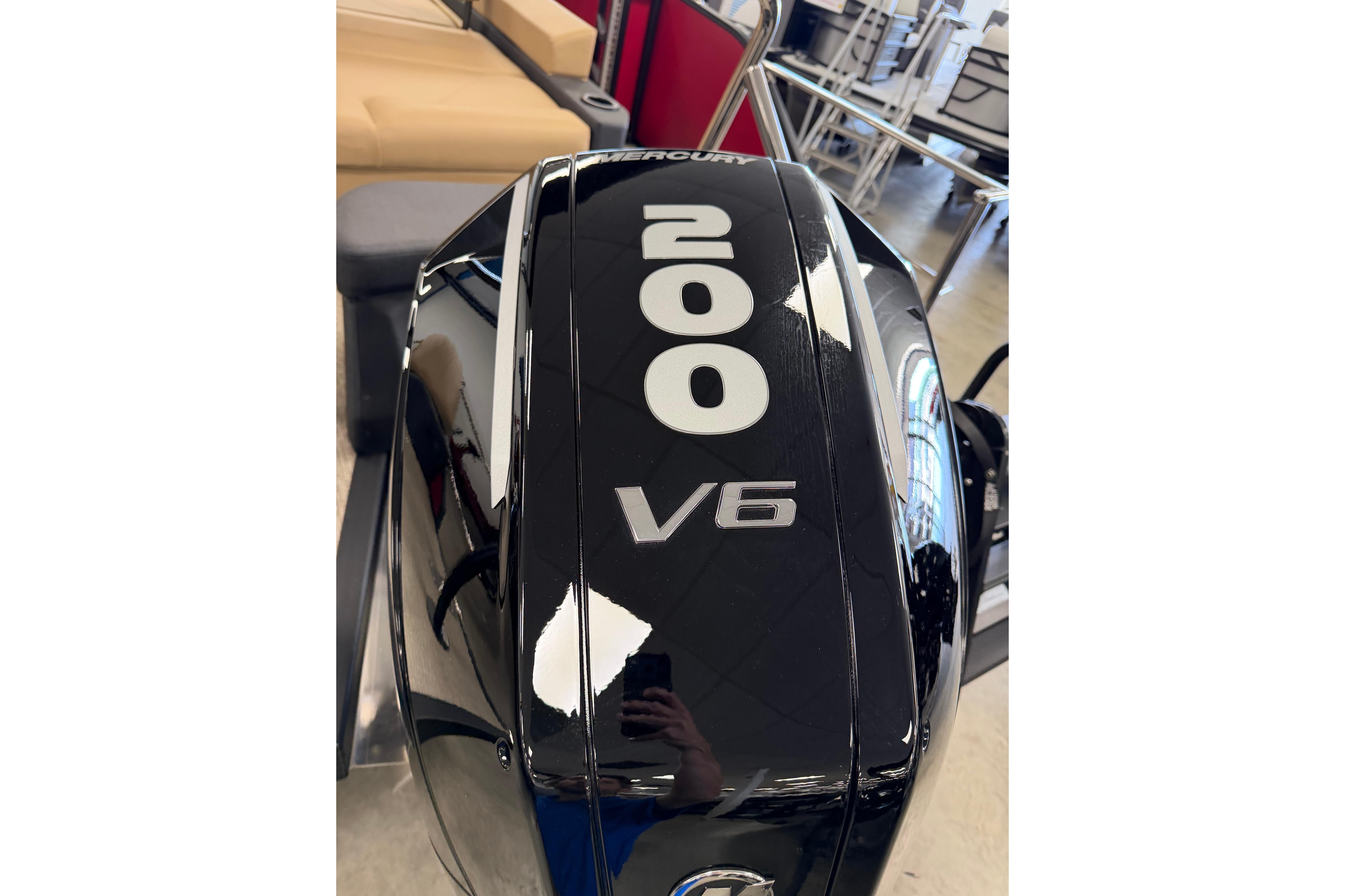 Black V6 outboard motor with "200" label, Evotti 523CS, 2026 model.