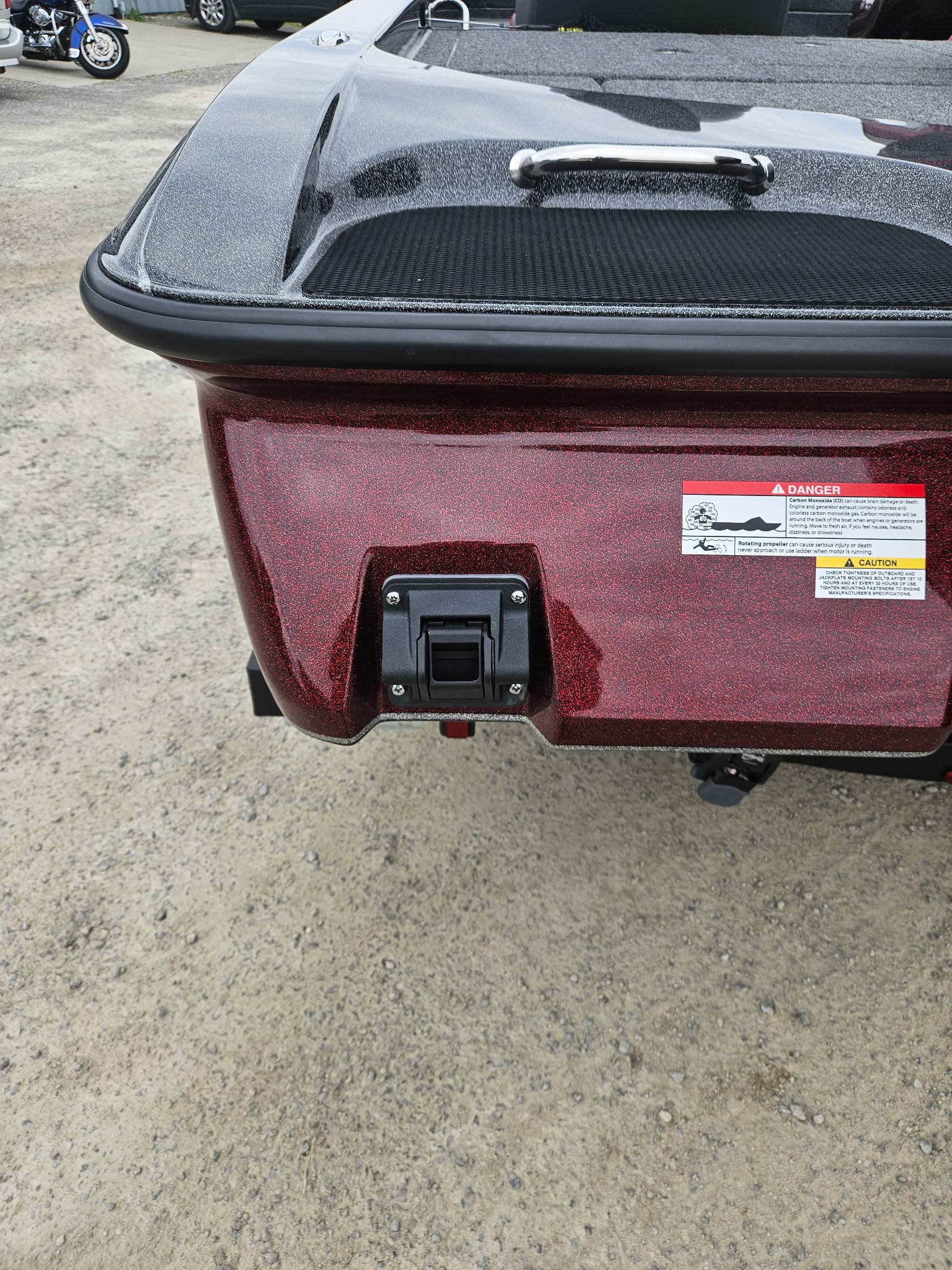 Red rear of a 2027 Caymas CX 21 PRO boat.