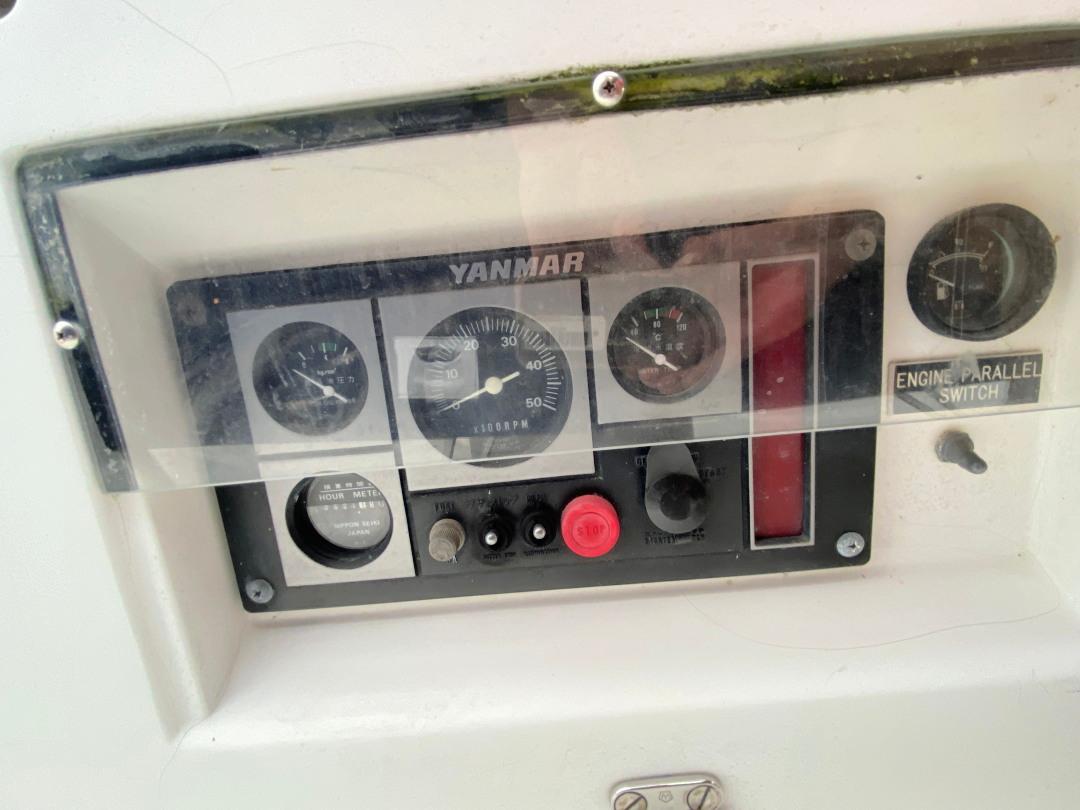 Control panel of a 2000 J Boats J/46 with Yanmar engine gauges and switches.