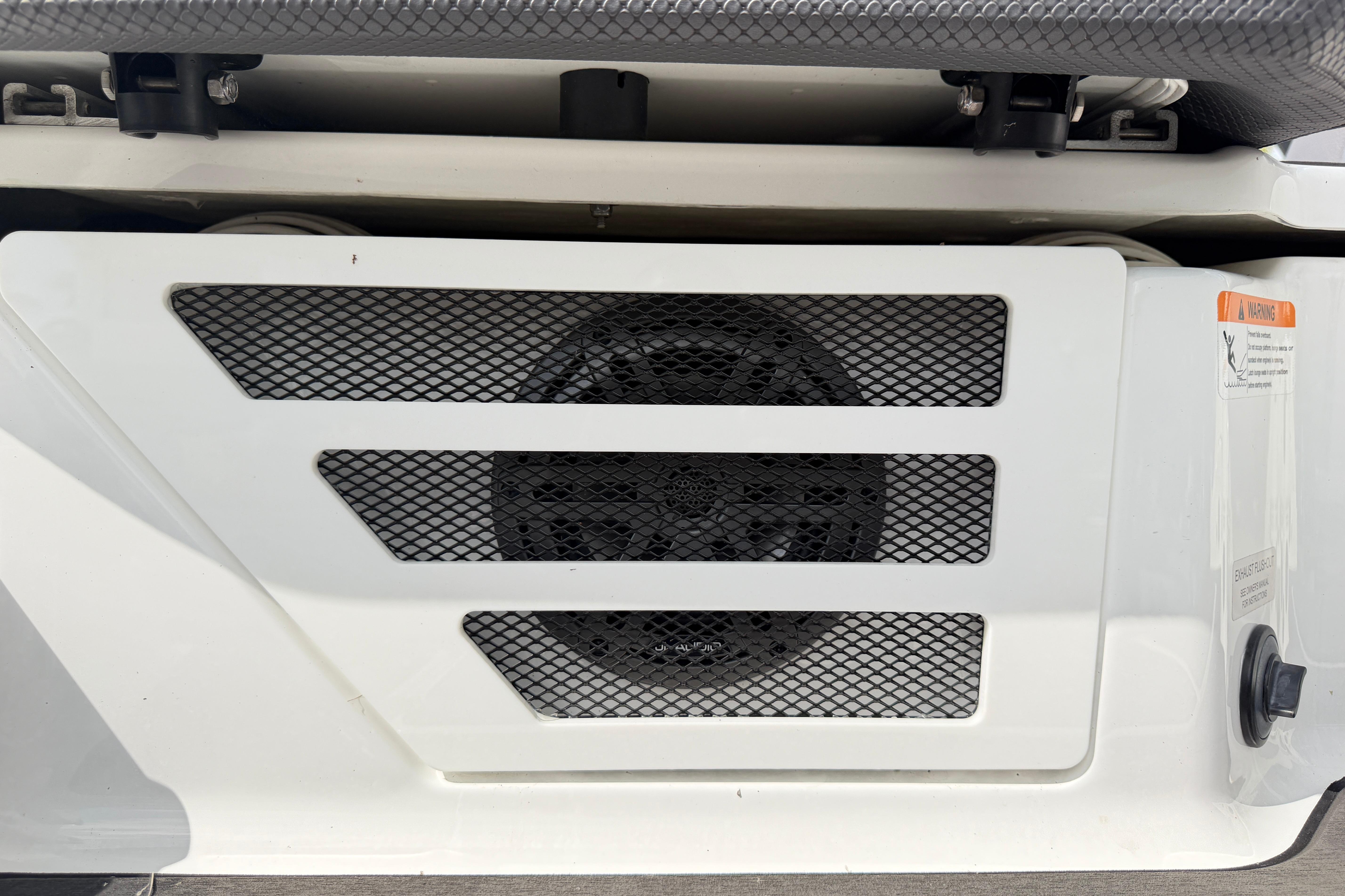 Ventilation grille on a 2026 Scarab 235 LX boat, featuring a mesh design.