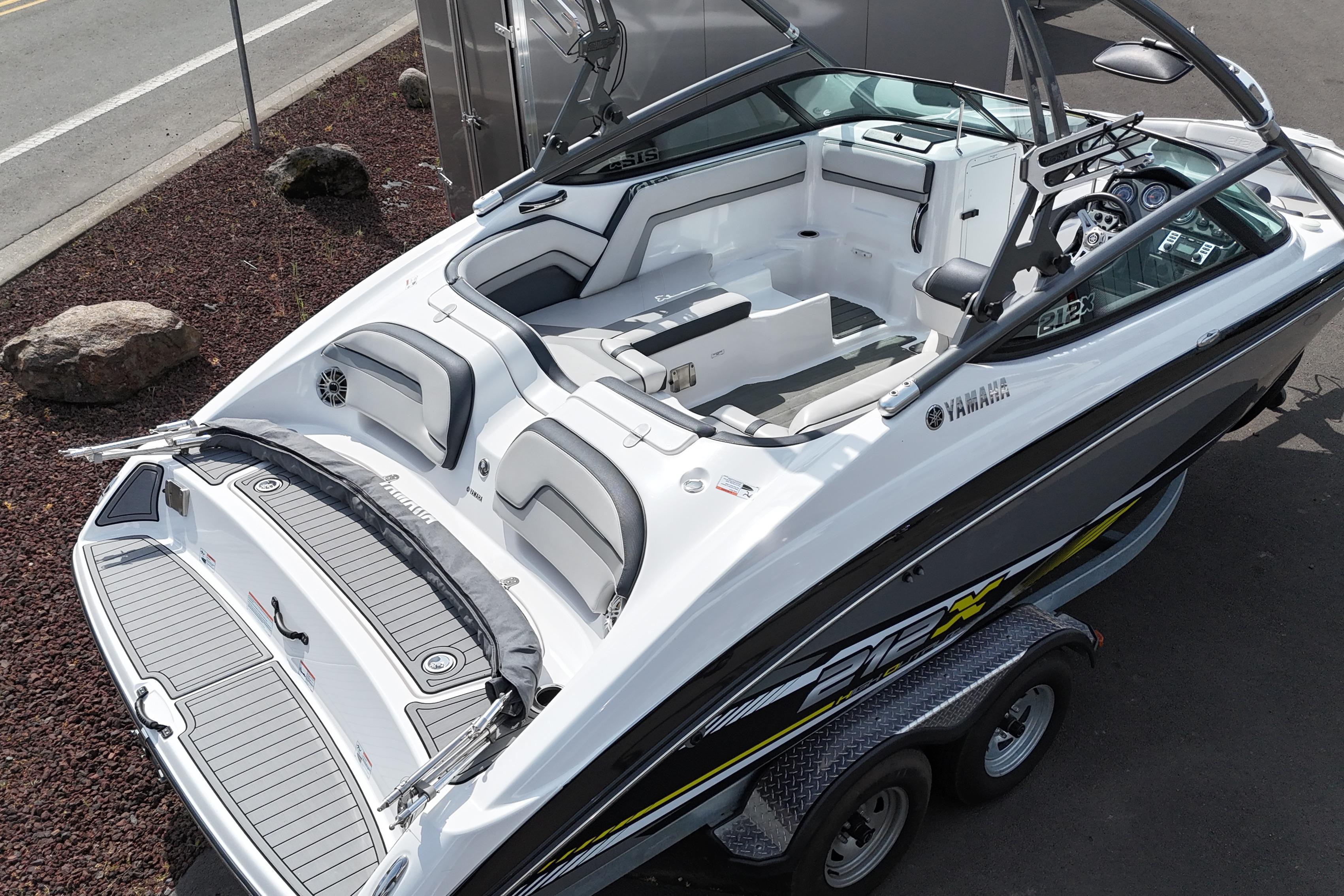 2016 Yamaha Boats 212X, sleek design, spacious interior, parked on trailer, ready for adventure.