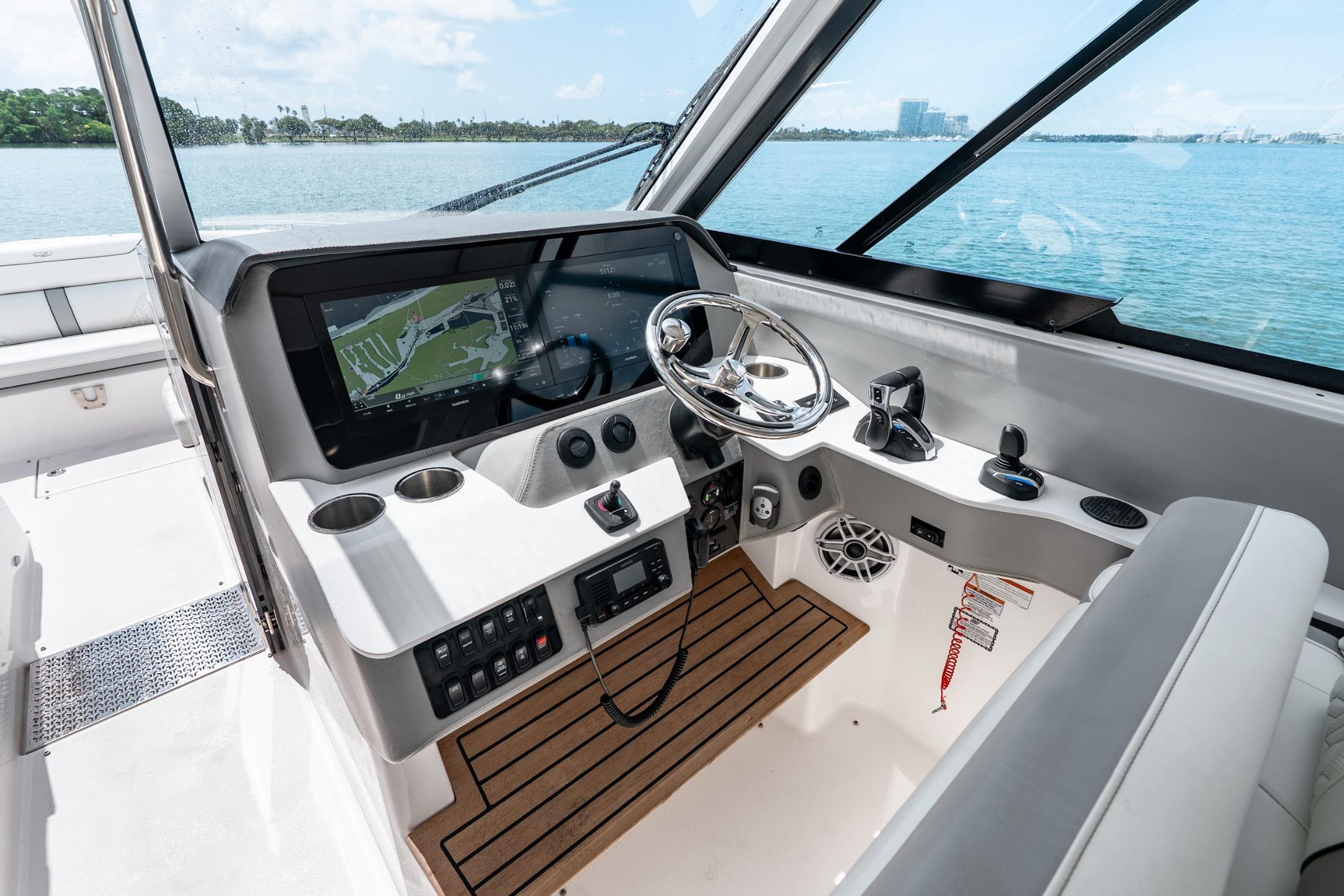 2023 Regal LX36 boat cockpit with modern navigation system and steering wheel.