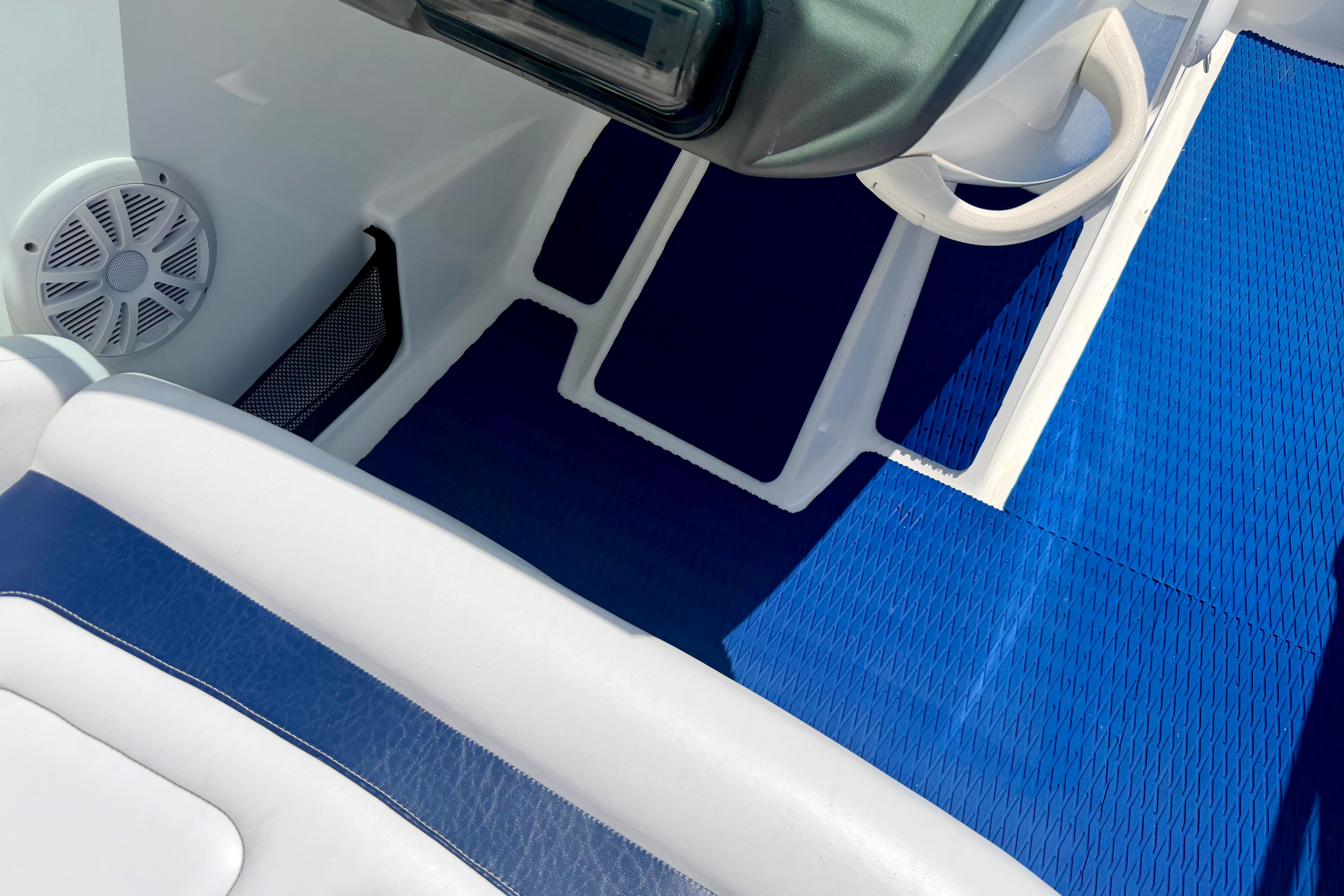 Interior of 2004 Bombardier SEADOO Utopia 185 with blue and white seating.