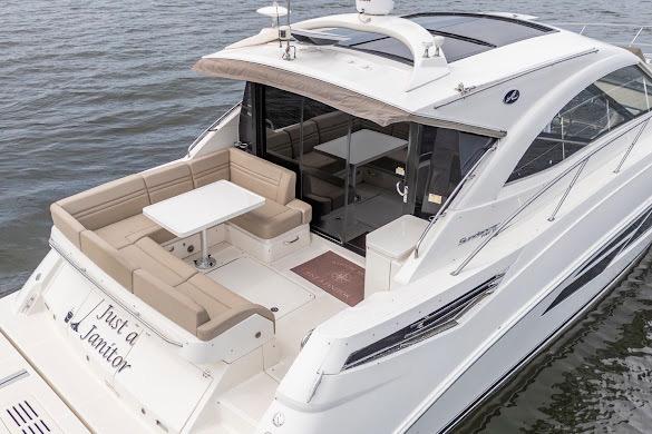 2016 Sea Ray Sundancer 510 yacht with spacious deck and seating on the water.