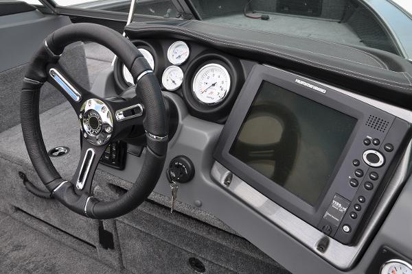 Manufacturer Provided Image: 2019 Lund 2175 Pro-V boat dashboard with steering wheel and electronic display.