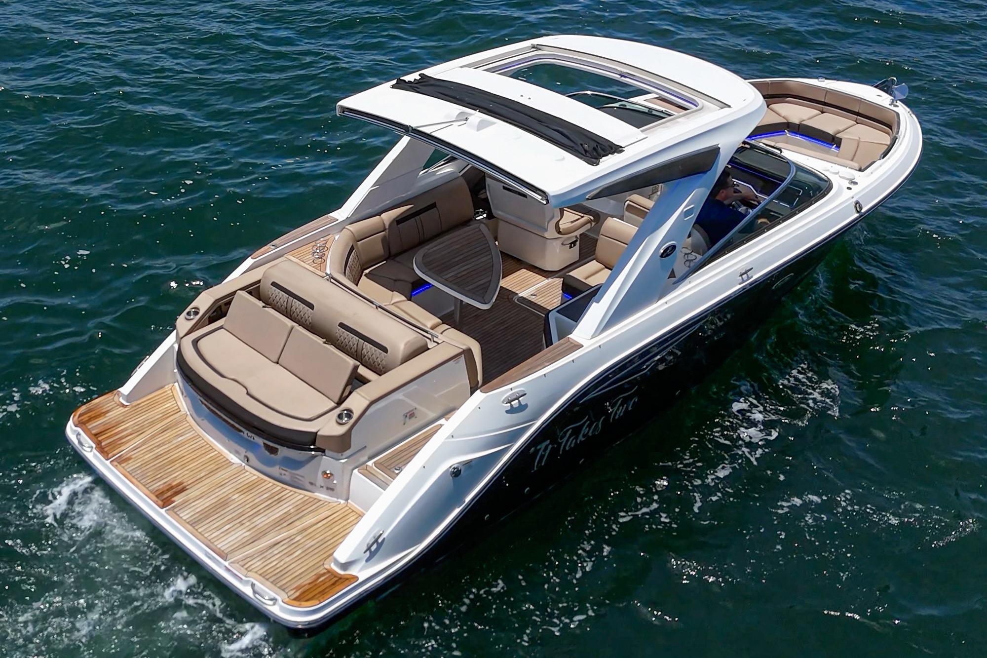 2018 Sea Ray SLX 310 boat cruising on open water, featuring spacious seating and sleek design.