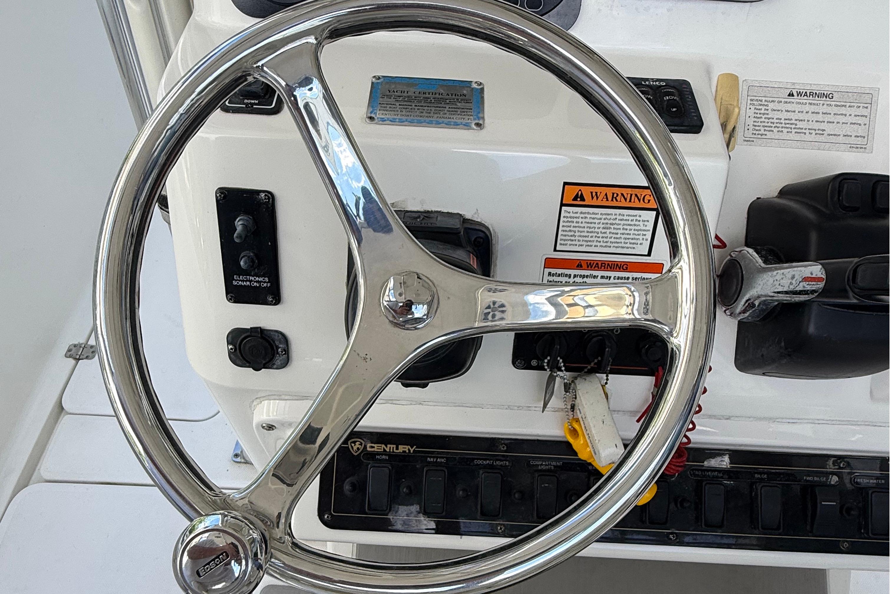Steering wheel and controls of a 2008 Century 2901 Center Console boat.