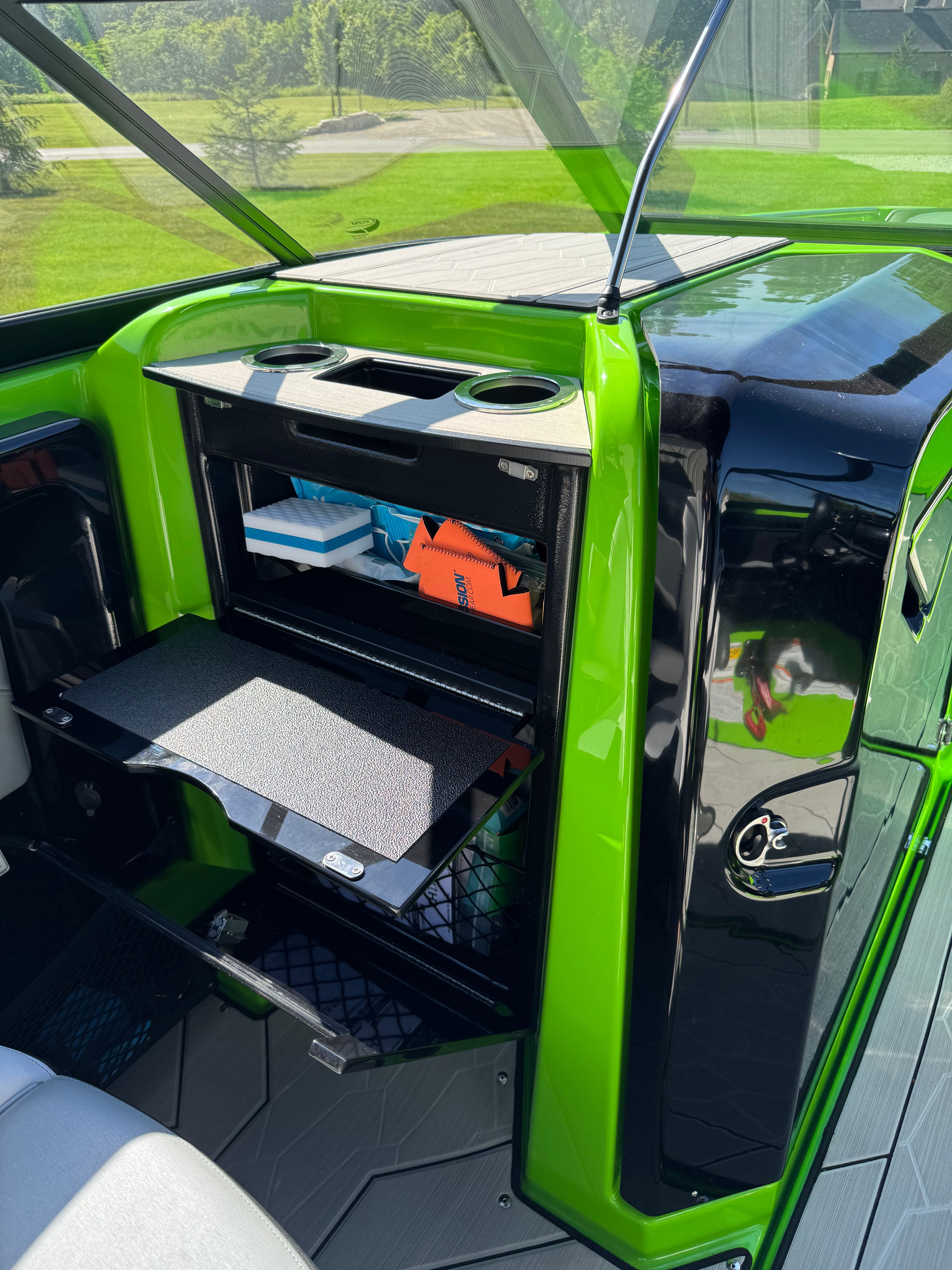 Green Yamaha 255XD with storage and accessories.