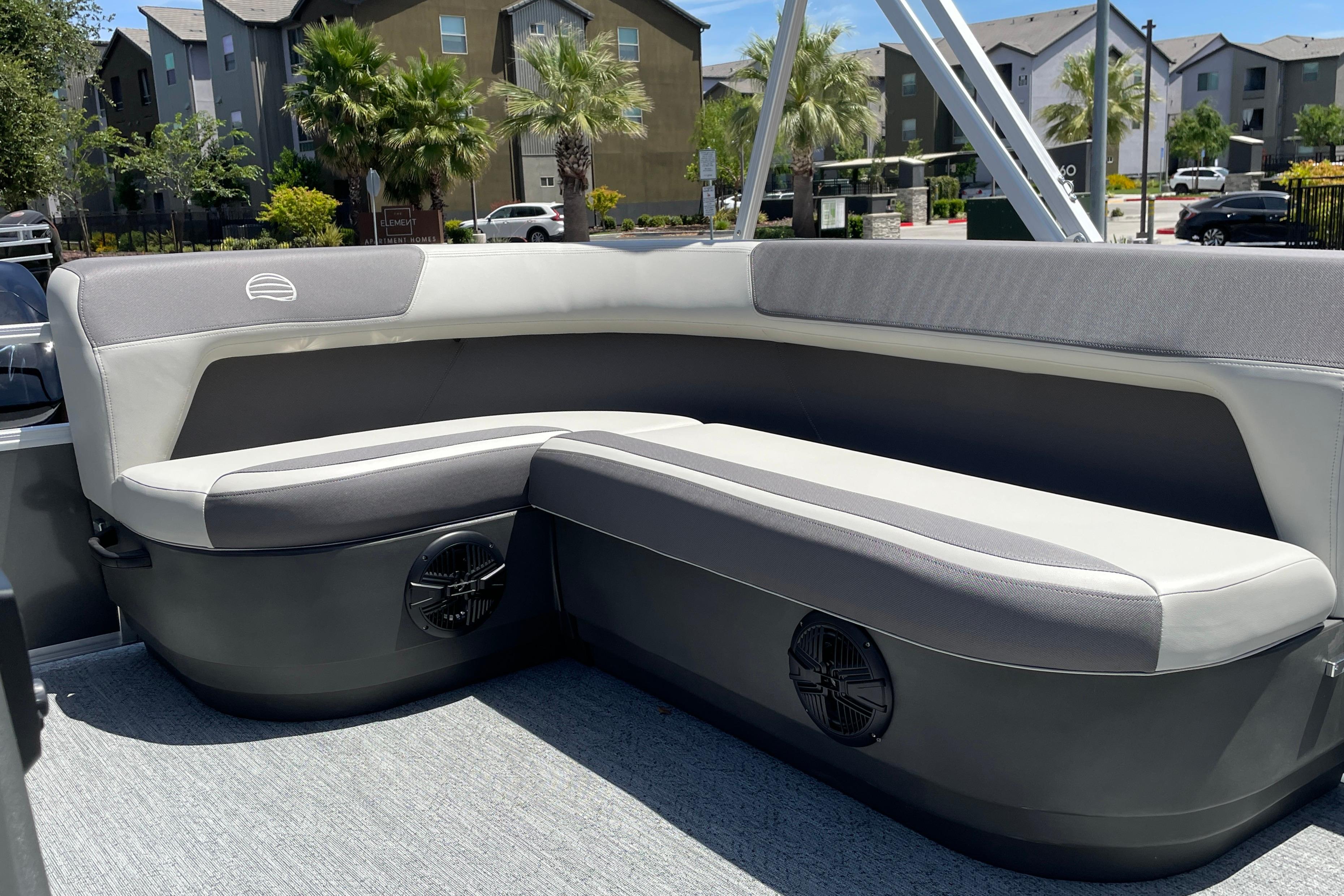 2026 Sun Tracker Bass Buggy 16 XL Select pontoon boat with comfortable seating and modern design.