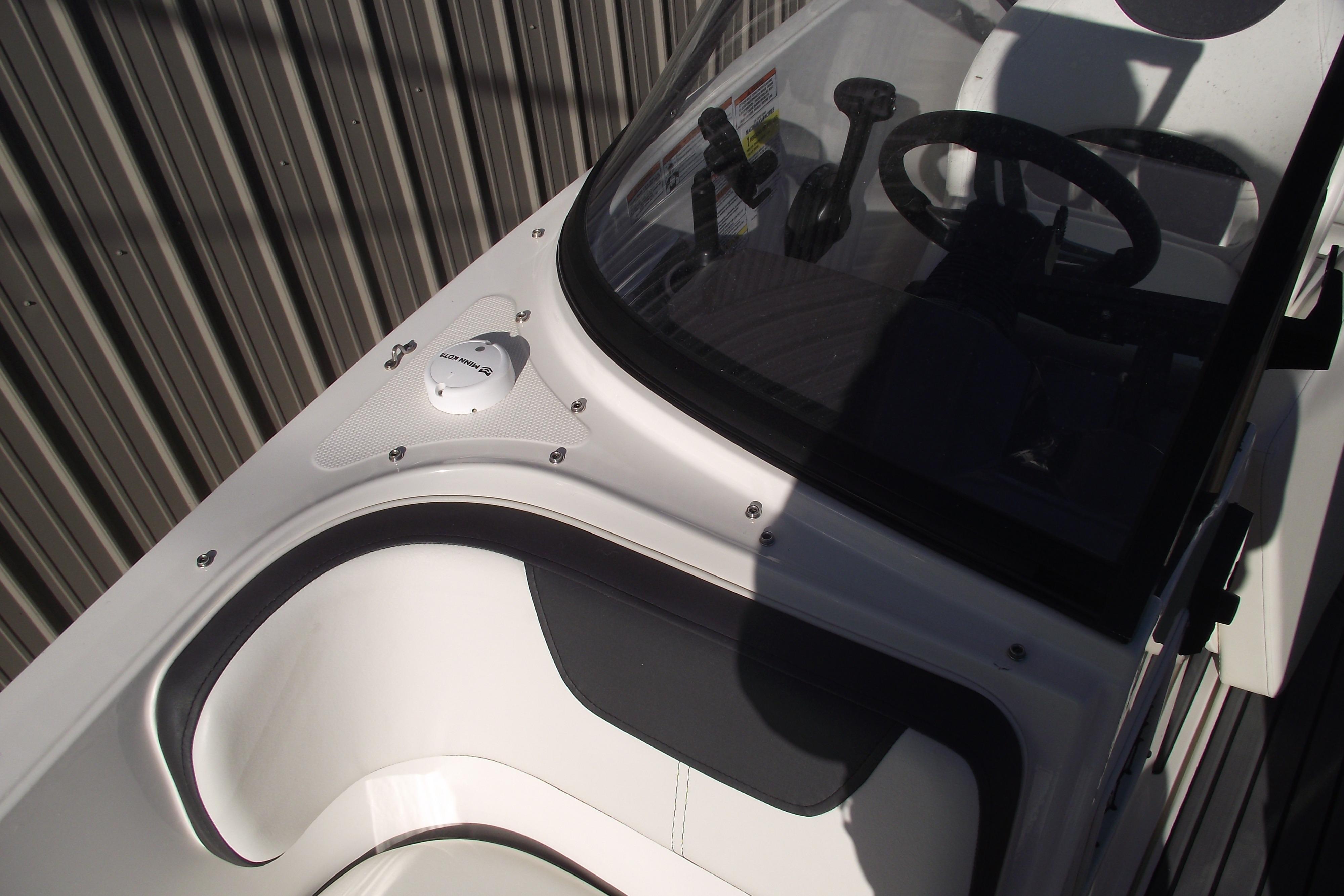 2022 Bayliner VR4 Bowrider OB cockpit with steering wheel and seating detail.