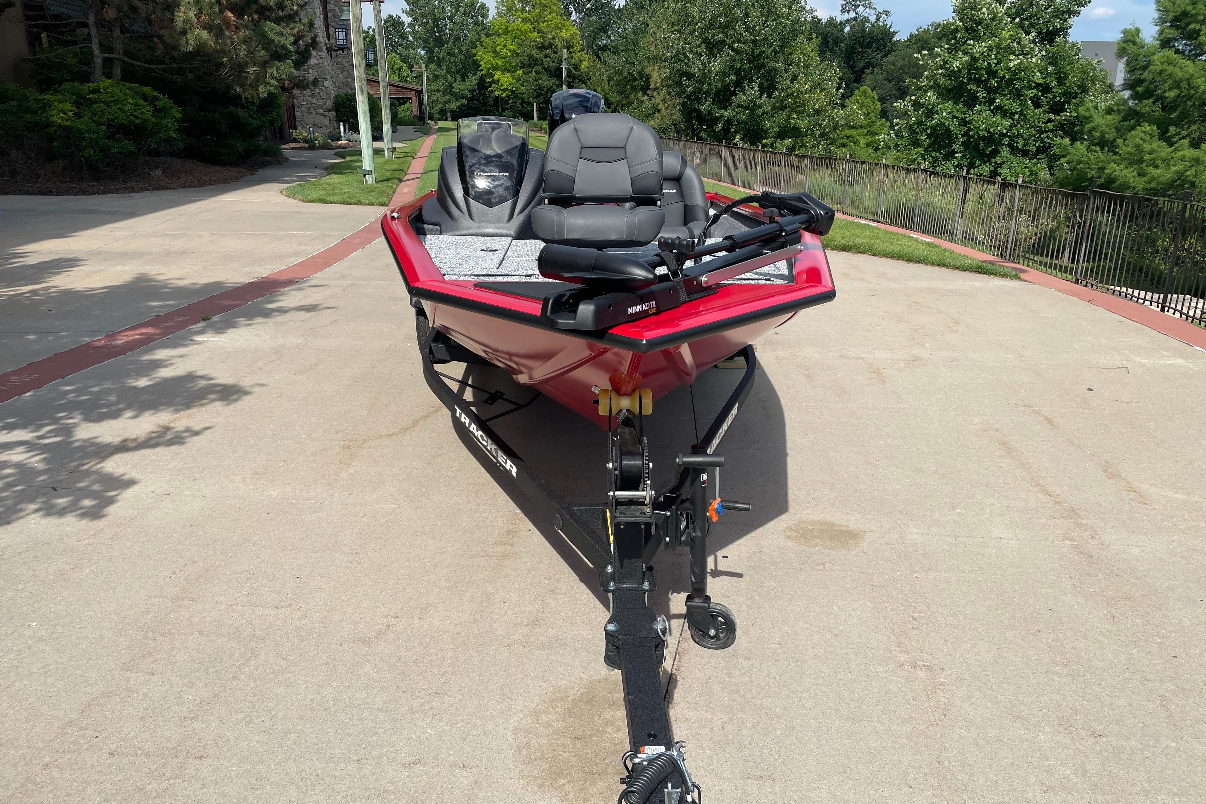 2026 Tracker Pro Team 190 boat on trailer, parked outdoors on a sunny day.