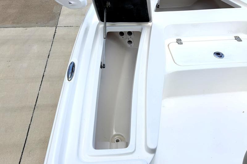 2025 Key West 210 Bay Reef boat storage compartment with open hatch.