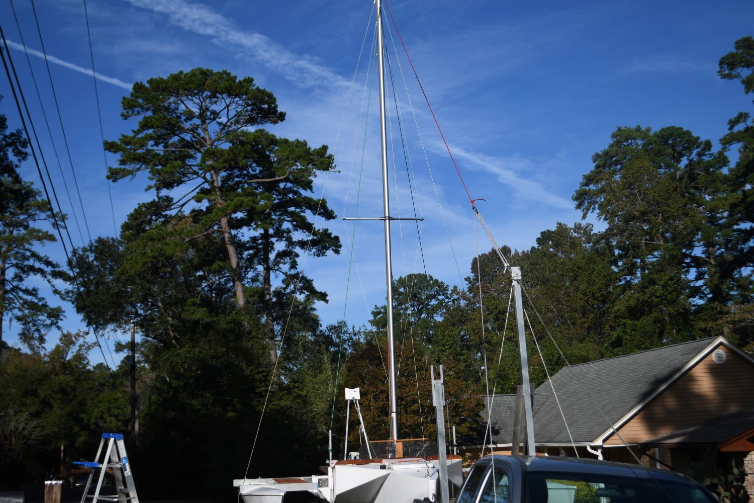 Custom Strike 18 sailboat from 2020 parked outdoors.