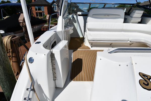 1997 Sea Ray 400 Sundancer boat deck with white seating and wood flooring.