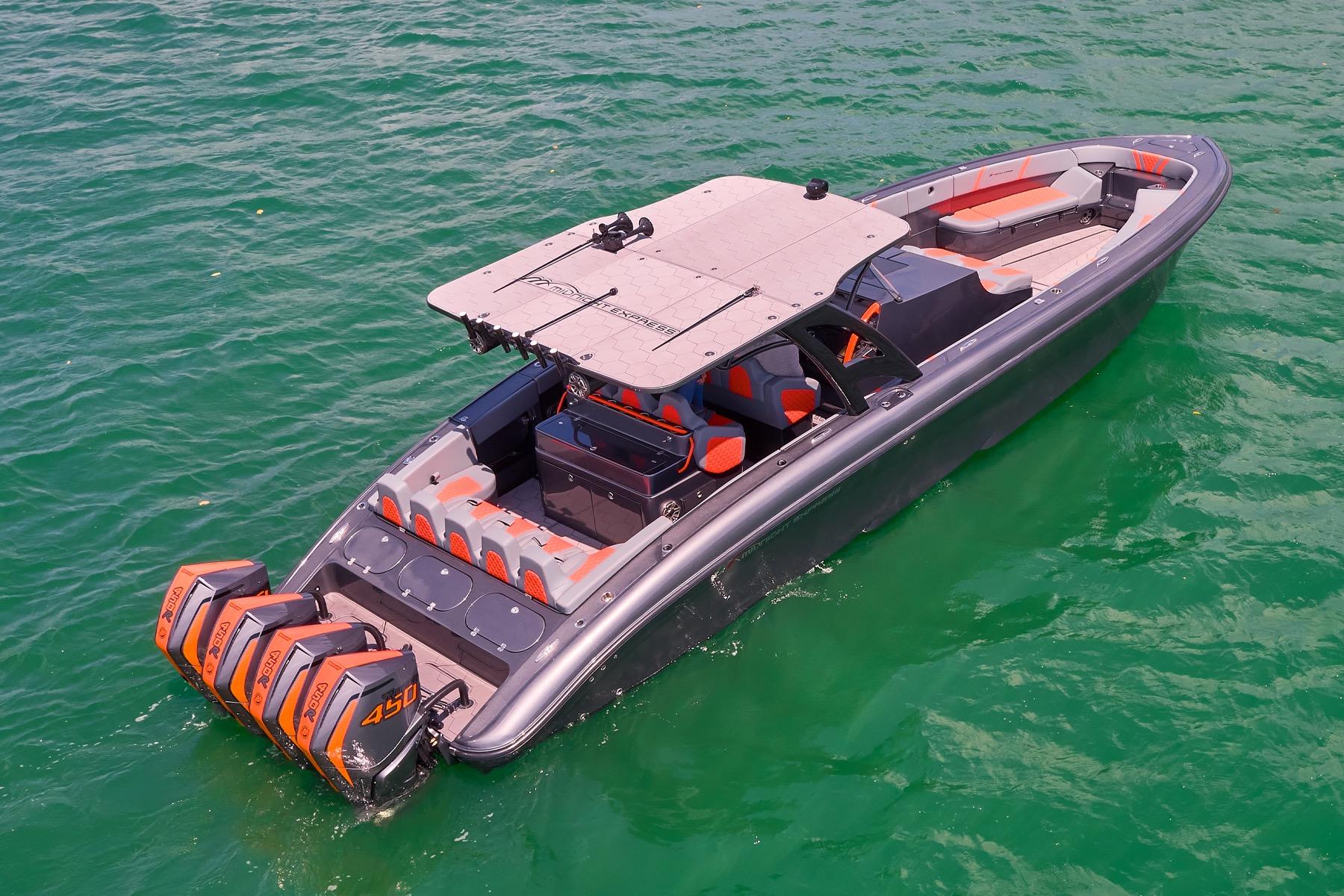 2022 Midnight Express 43 Open boat with quad engines on turquoise water.