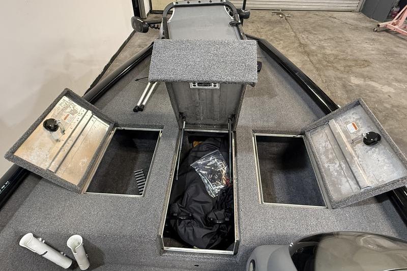 2016 Tracker Pro Team 175 TXW boat storage compartments open, showcasing interior space.