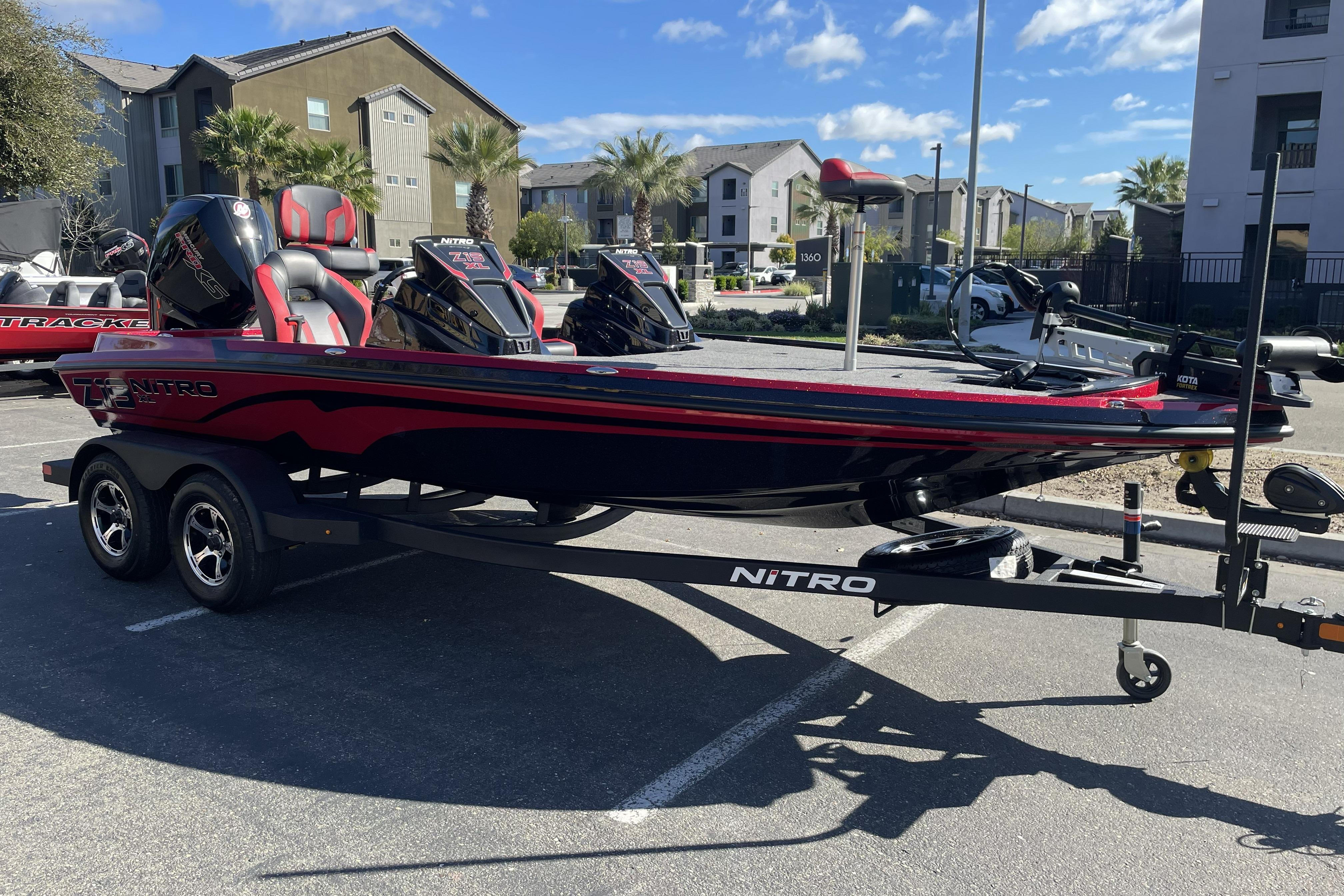 2026 Nitro Z19 XL boat on trailer in parking lot, sunny day.