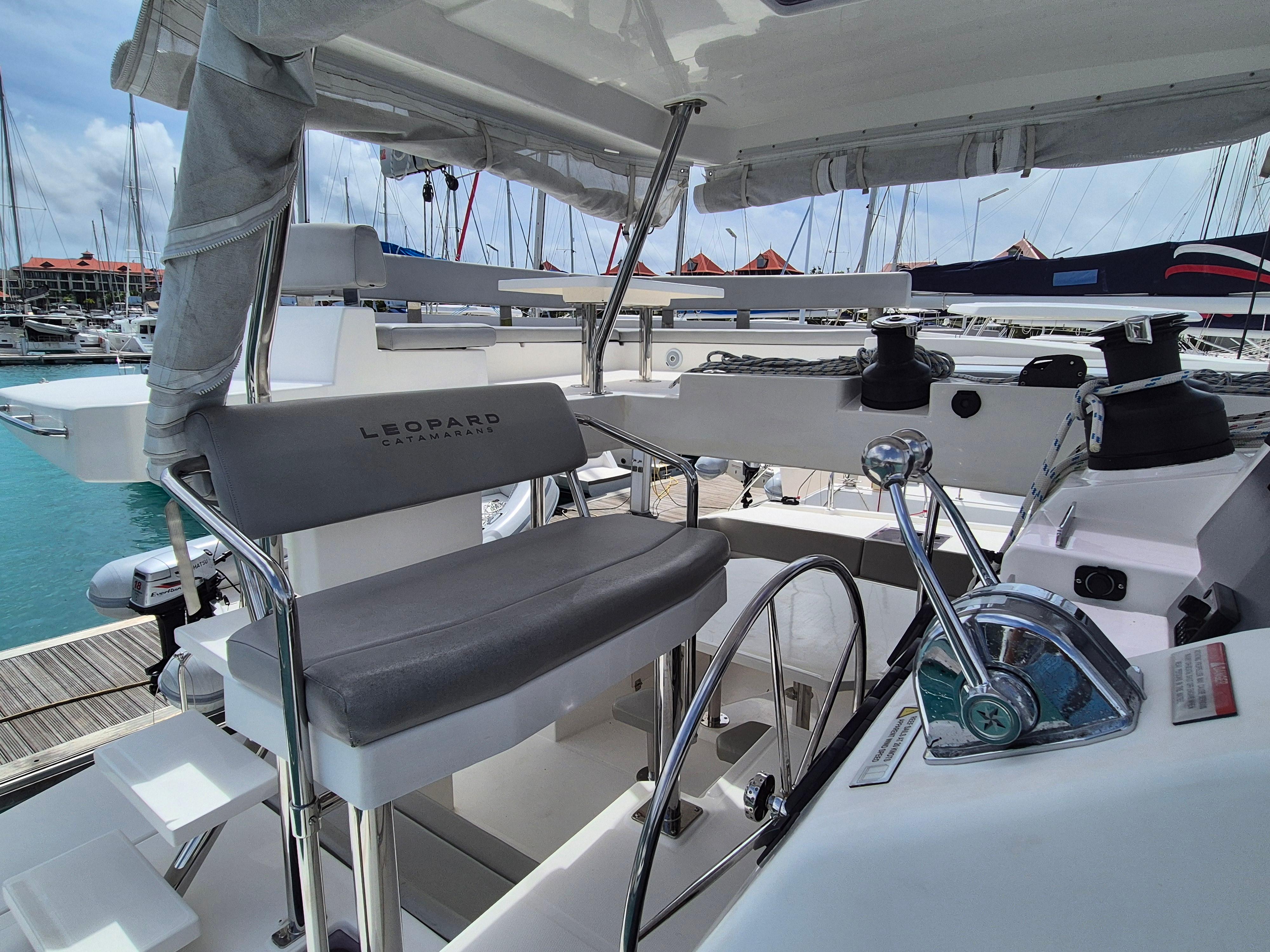 Helm station of 2020 Leopard 50 catamaran with modern controls and seating.