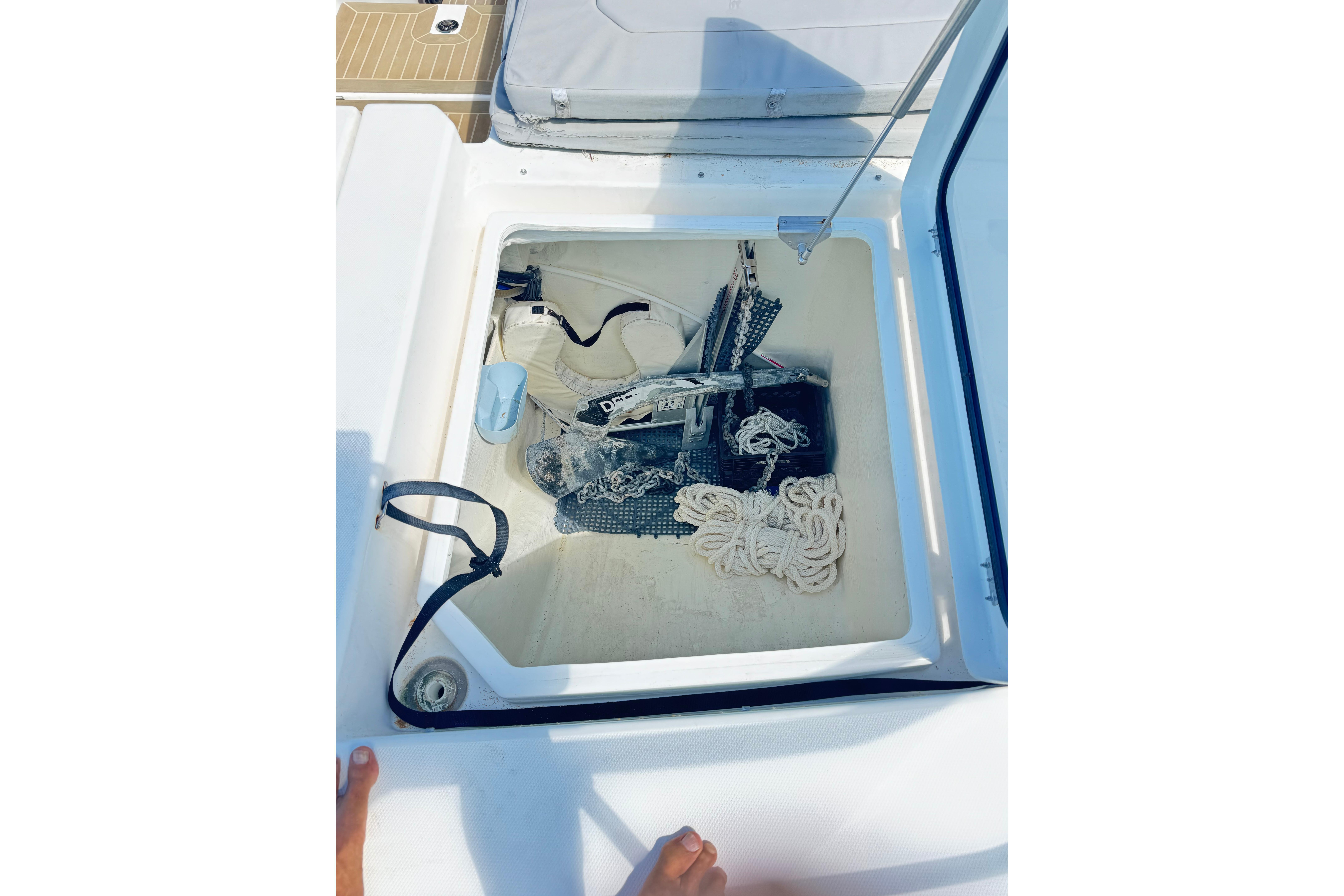 Storage compartment on a 2021 Leopard 53 Powercat, containing ropes and boating equipment.