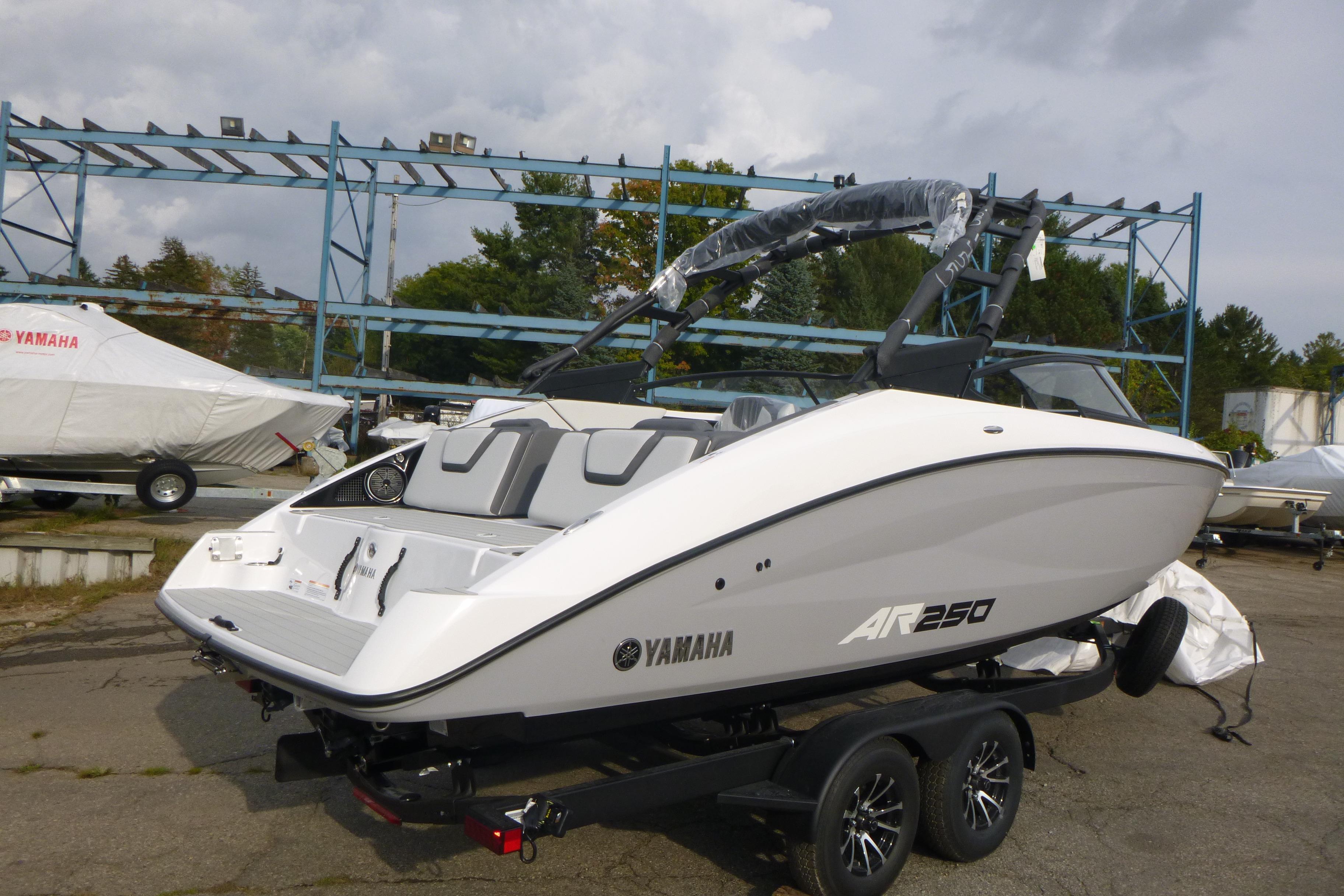 2026 Yamaha Boats AR250 on trailer, sleek design, outdoor setting.
