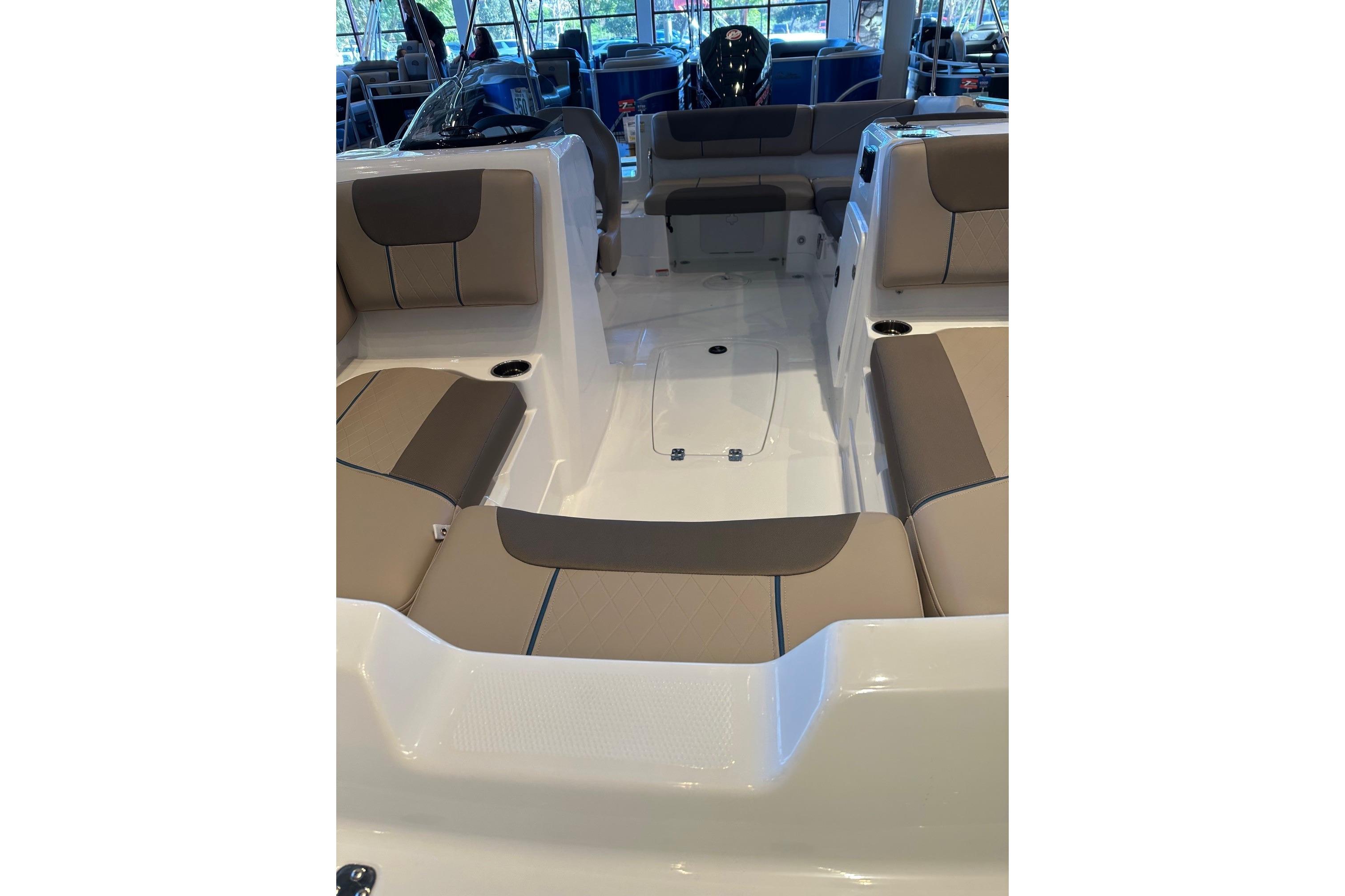 2026 Tahoe 1950 boat interior with beige seating and modern design.