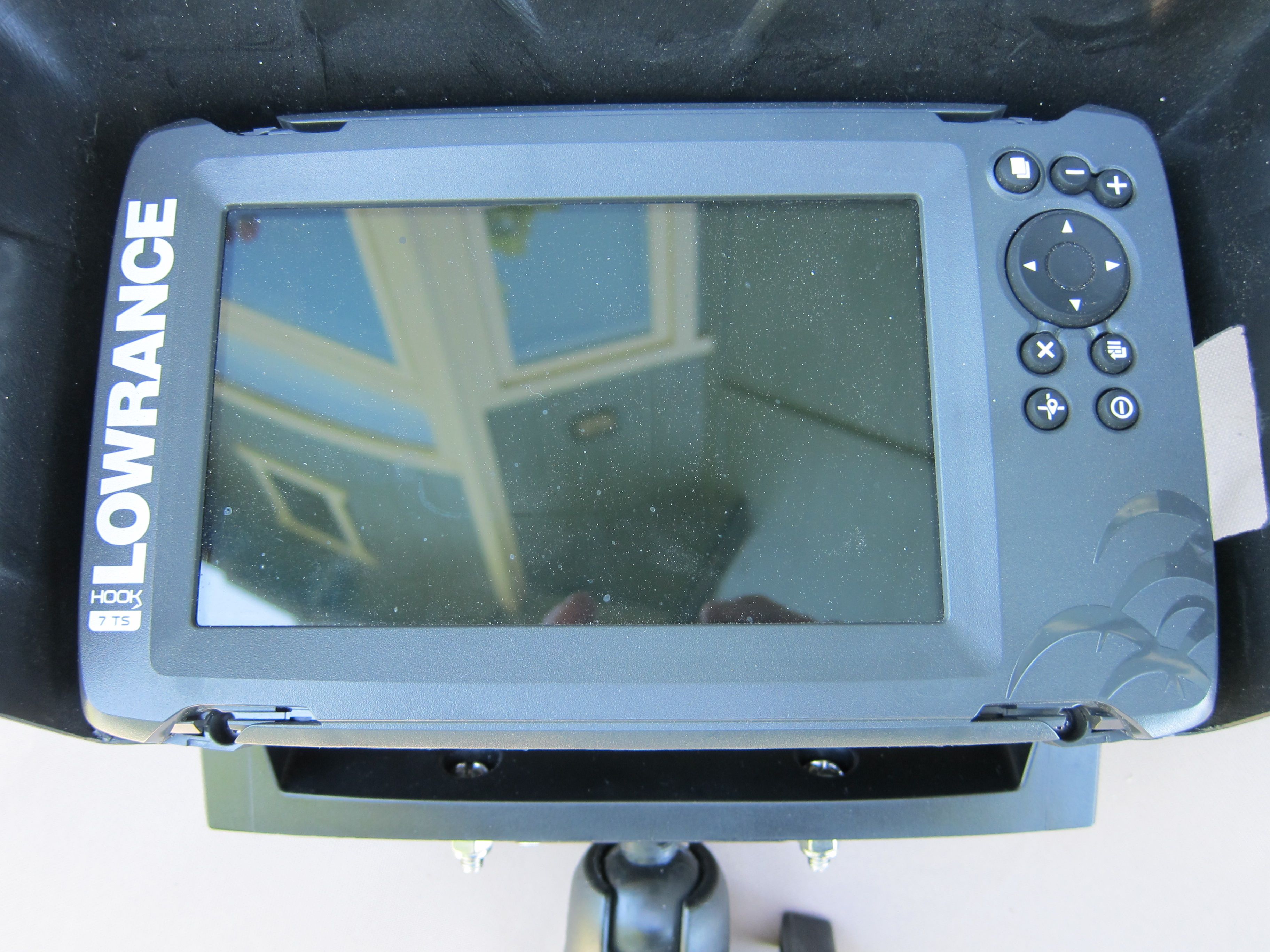 A Lowrance fish finder with a screen and control buttons.