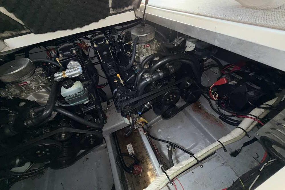 Engine compartment of a 2001 Monterey 282 Cruiser boat, showing dual engines and components.
