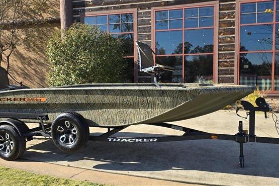 2026 Tracker Grizzly 1756 T Marsh boat on trailer, parked outdoors.