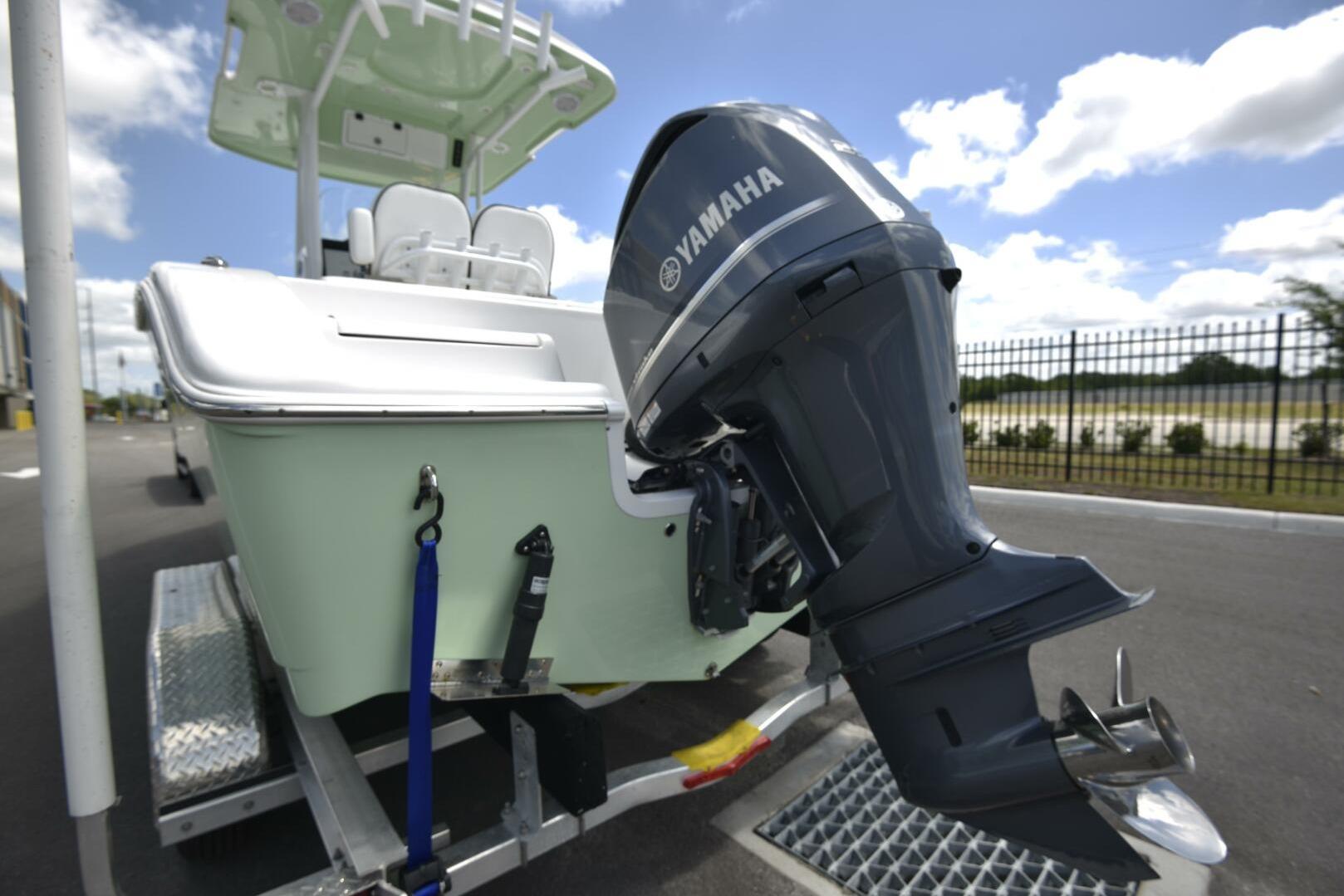 2023 Sea Pro 239 Deep V CC boat with Yamaha outboard motor on trailer.