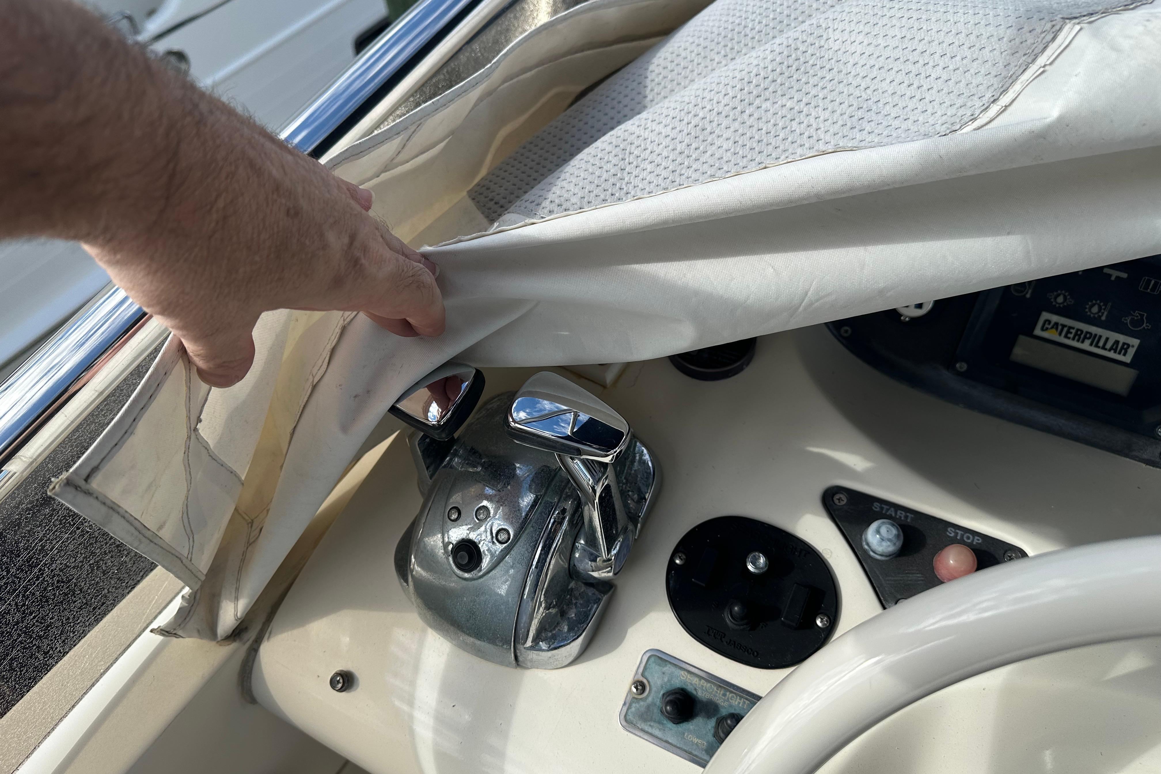 Close-up of 2004 Azimut 55E yacht controls under protective cover.