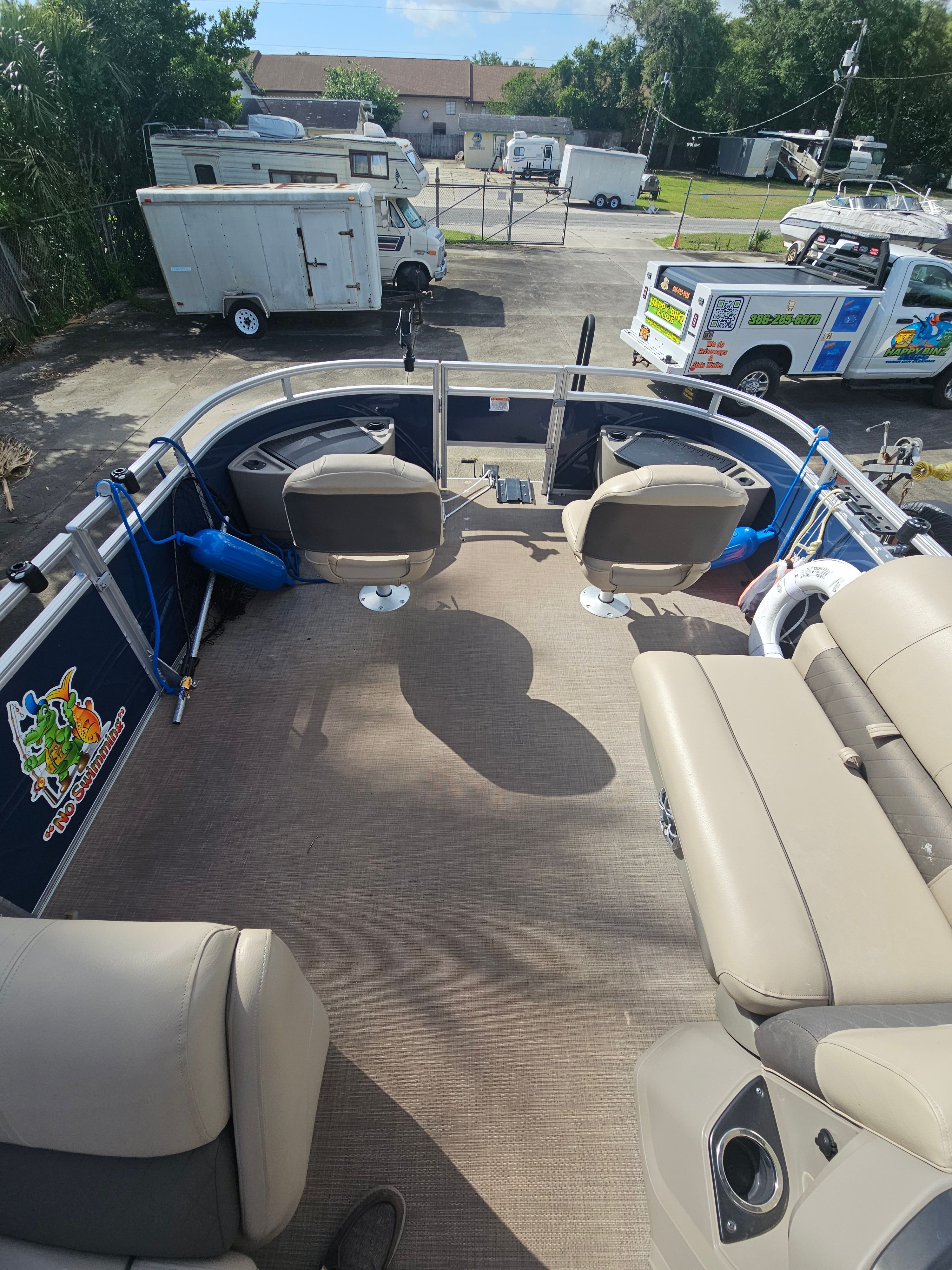 Interior view of 2024 Sun Tracker Fishin' Barge 22 DLX pontoon boat.