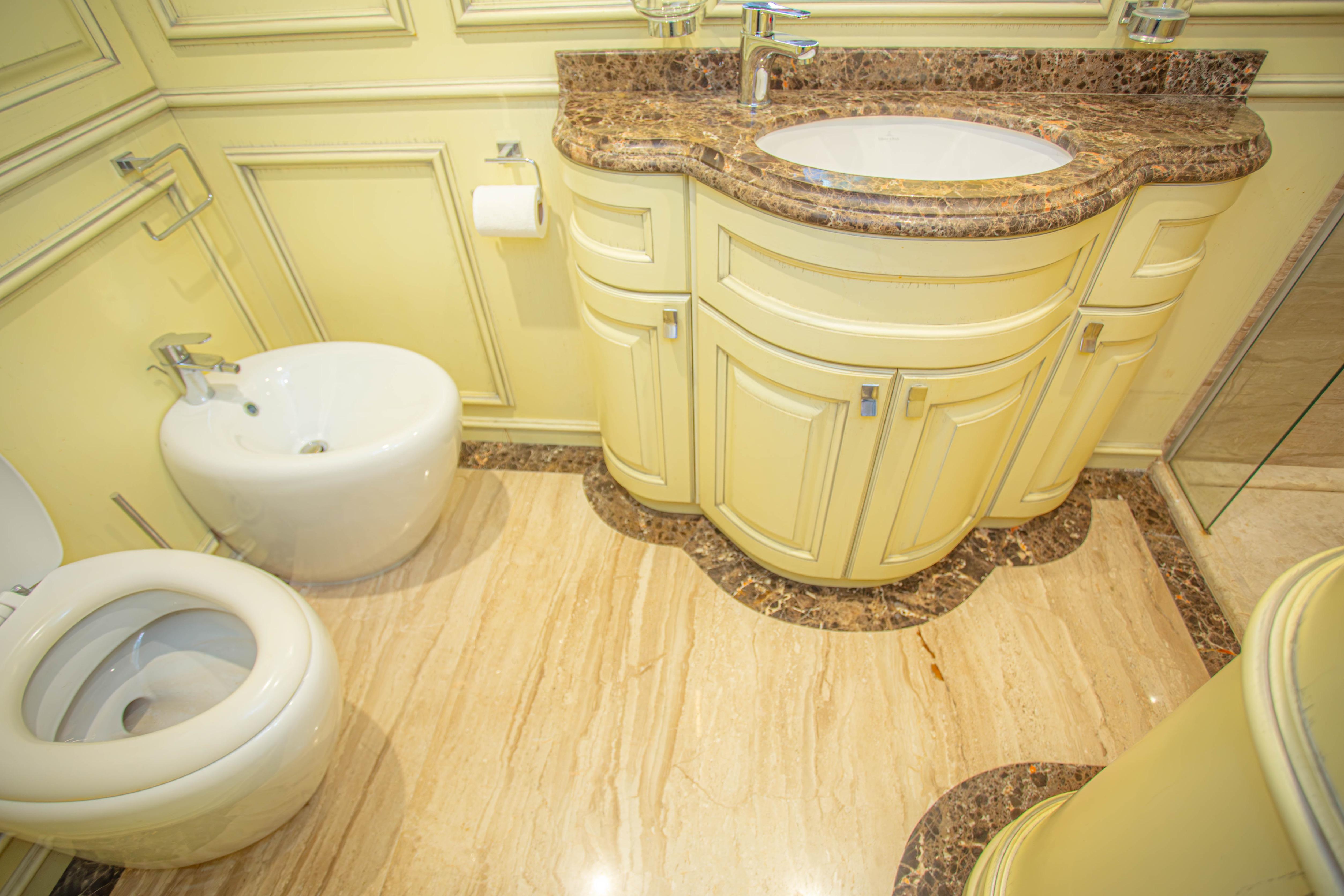 Luxurious yacht bathroom with marble countertop and elegant fixtures, Fifth Ocean Yachts 2014 model.