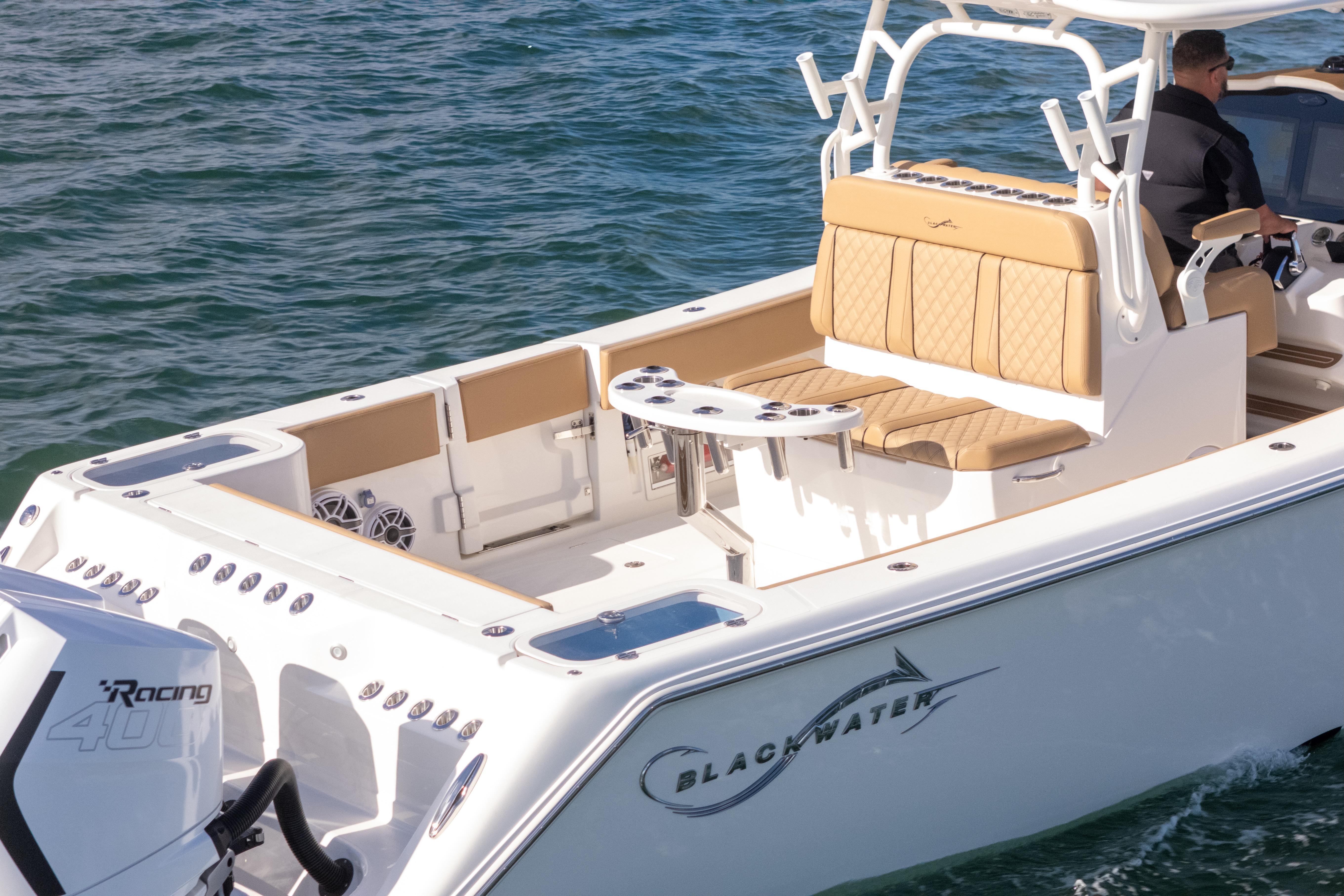 2026 Blackwater 41 Performance Fish boat on water, featuring luxurious seating and powerful engine.